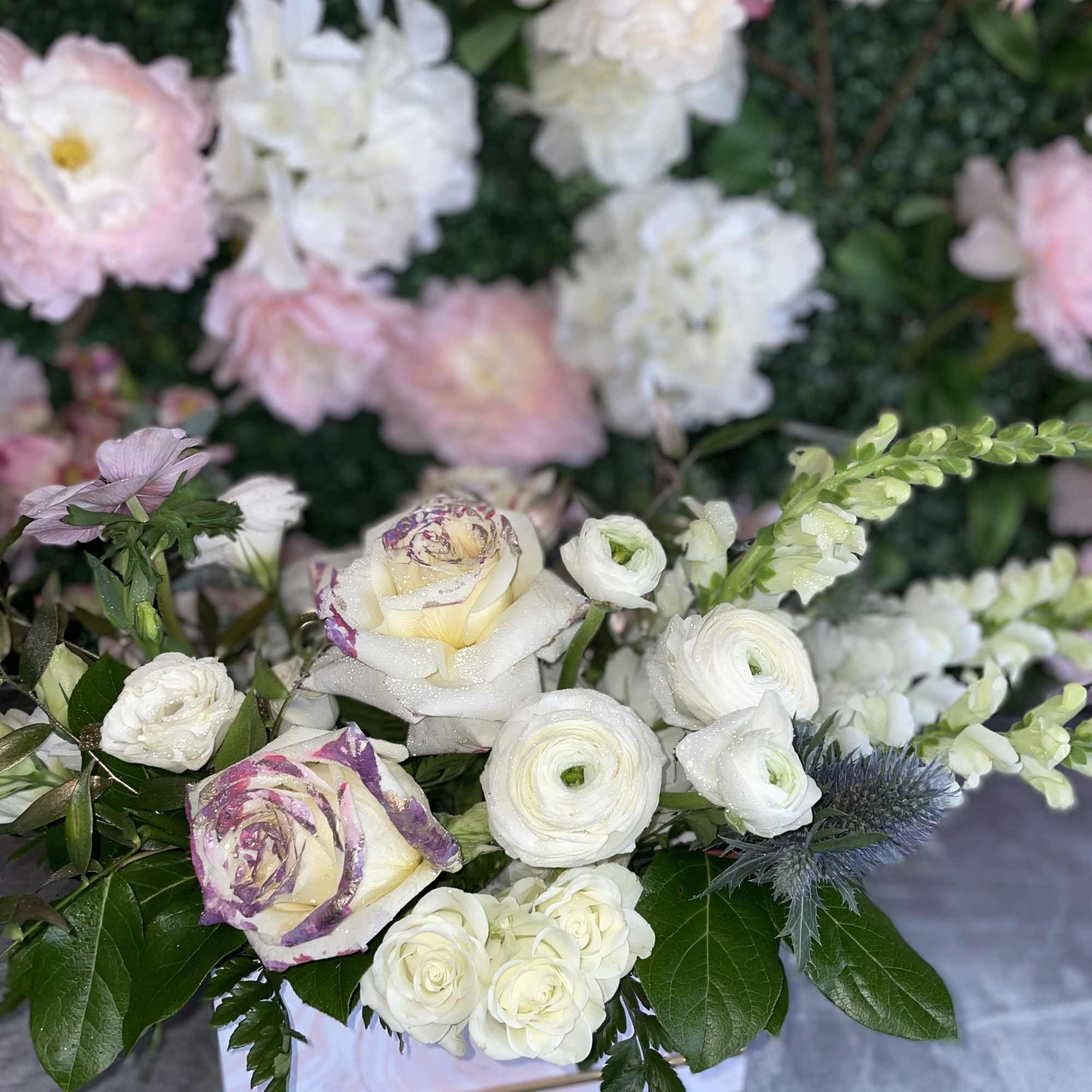 This perfect gift of flowers jas some premium white flowers, white roses