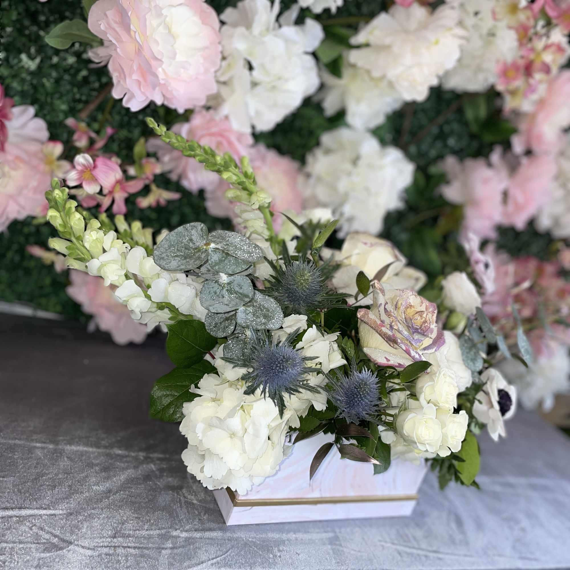 This perfect gift of flowers jas some premium white flowers, white roses