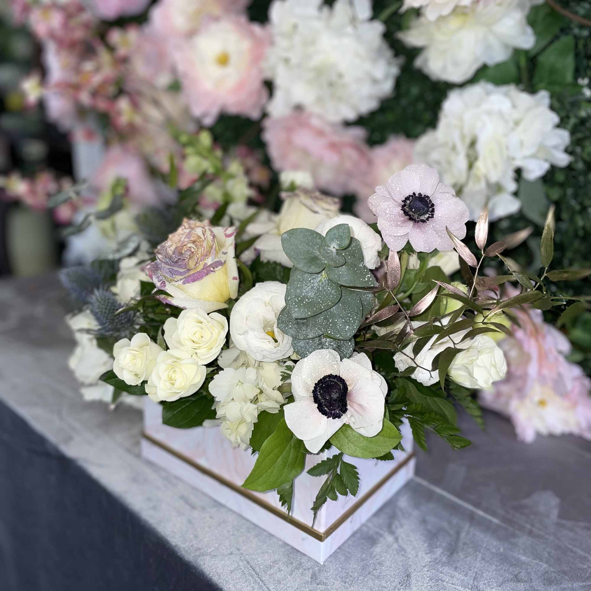 This perfect gift of flowers jas some premium white flowers, white roses