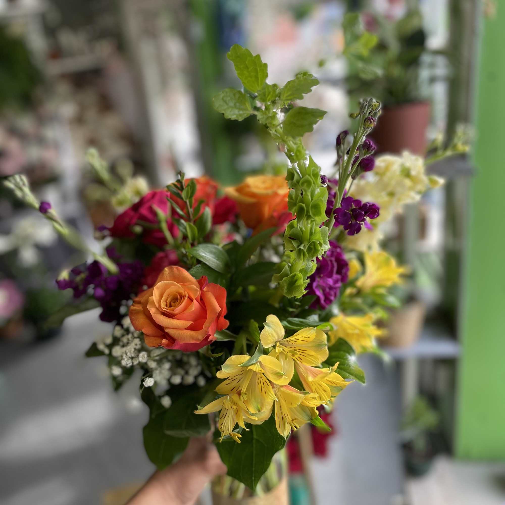 This beautiful arrangement has gorgeous colors and has yellow alstro, orange roses