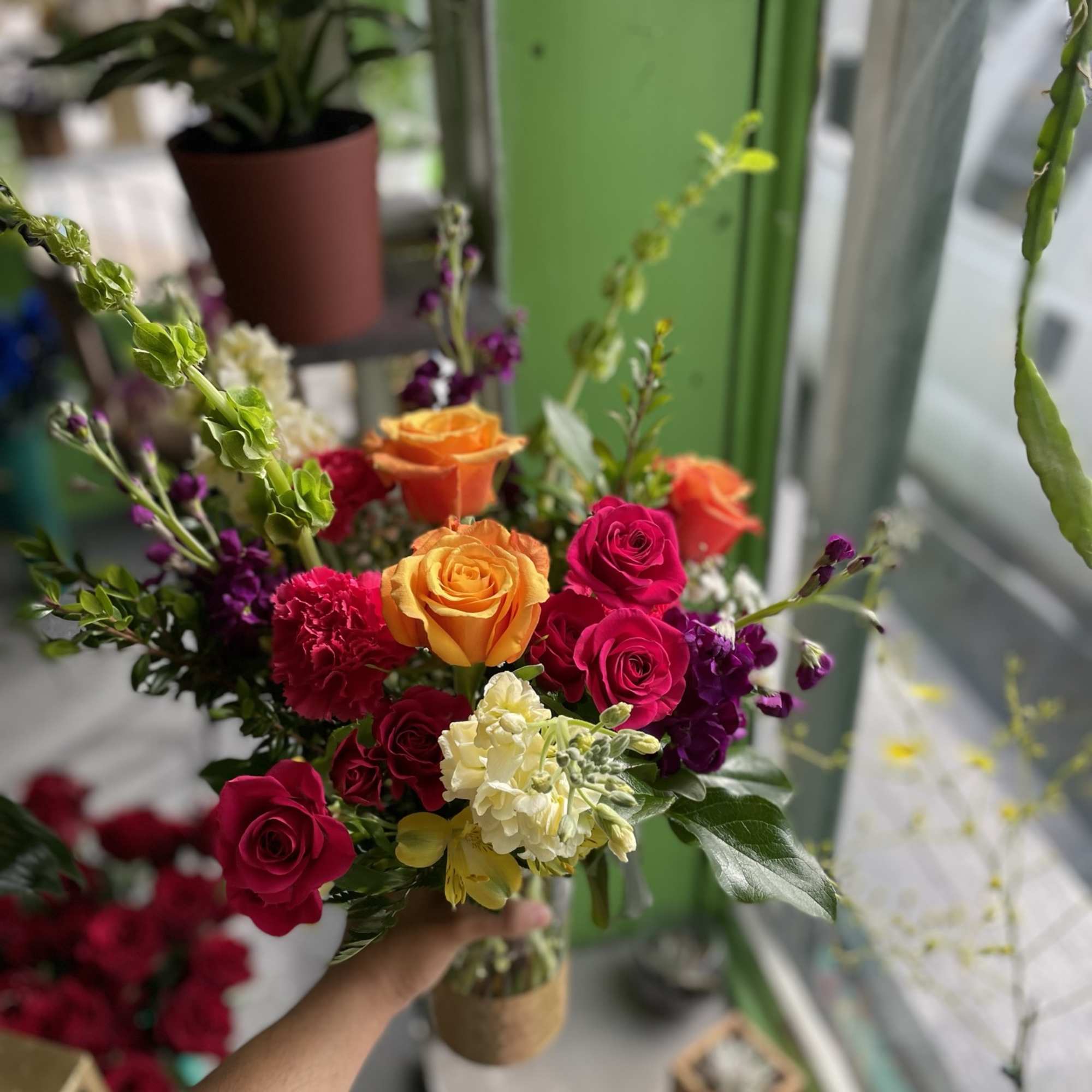 This beautiful arrangement has gorgeous colors and has yellow alstro, orange roses