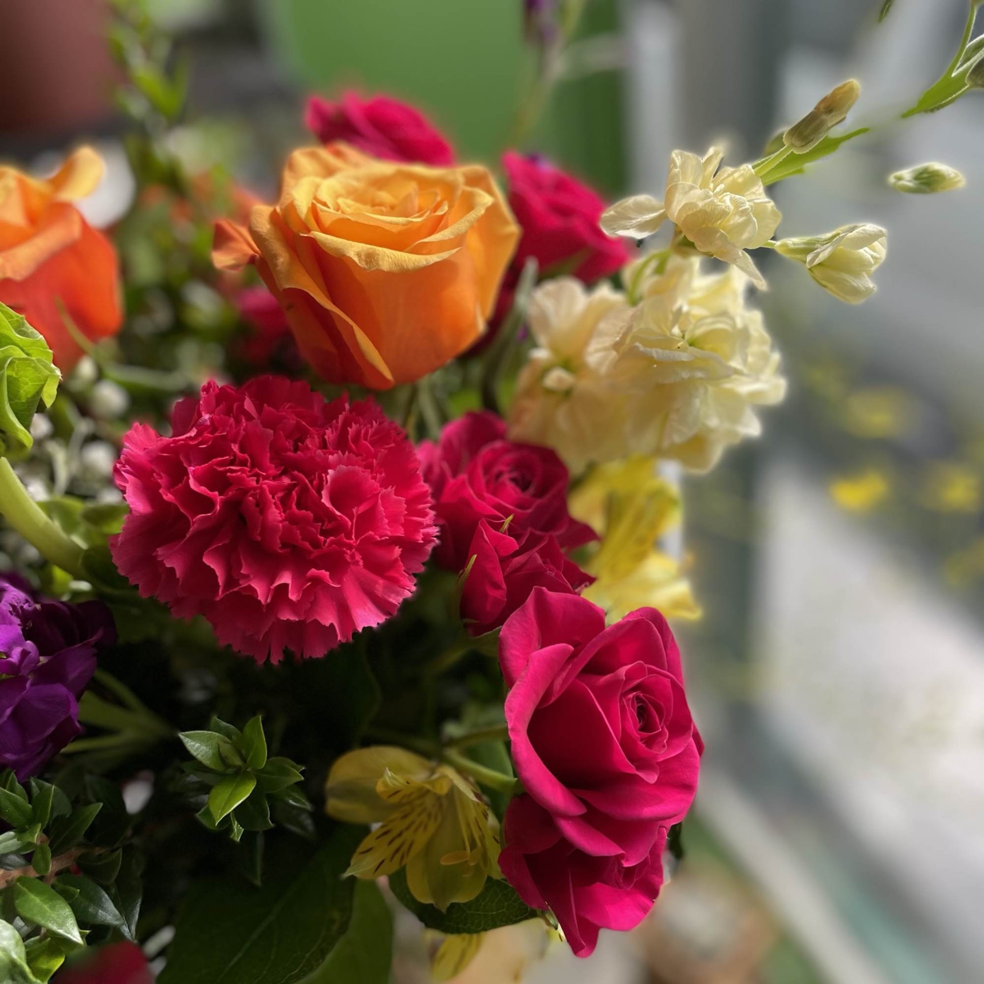 This beautiful arrangement has gorgeous colors and has yellow alstro, orange roses