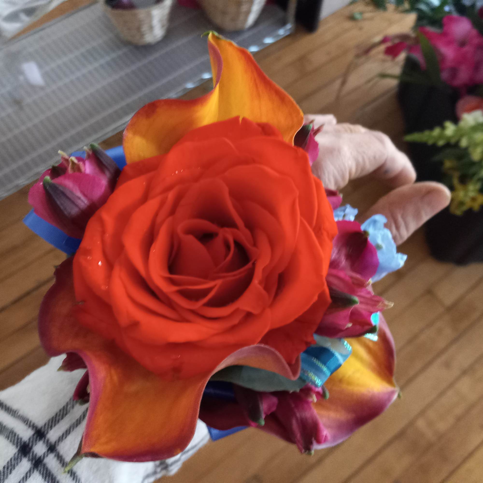 Bright orange &amp; whimsical blue wedding corsage