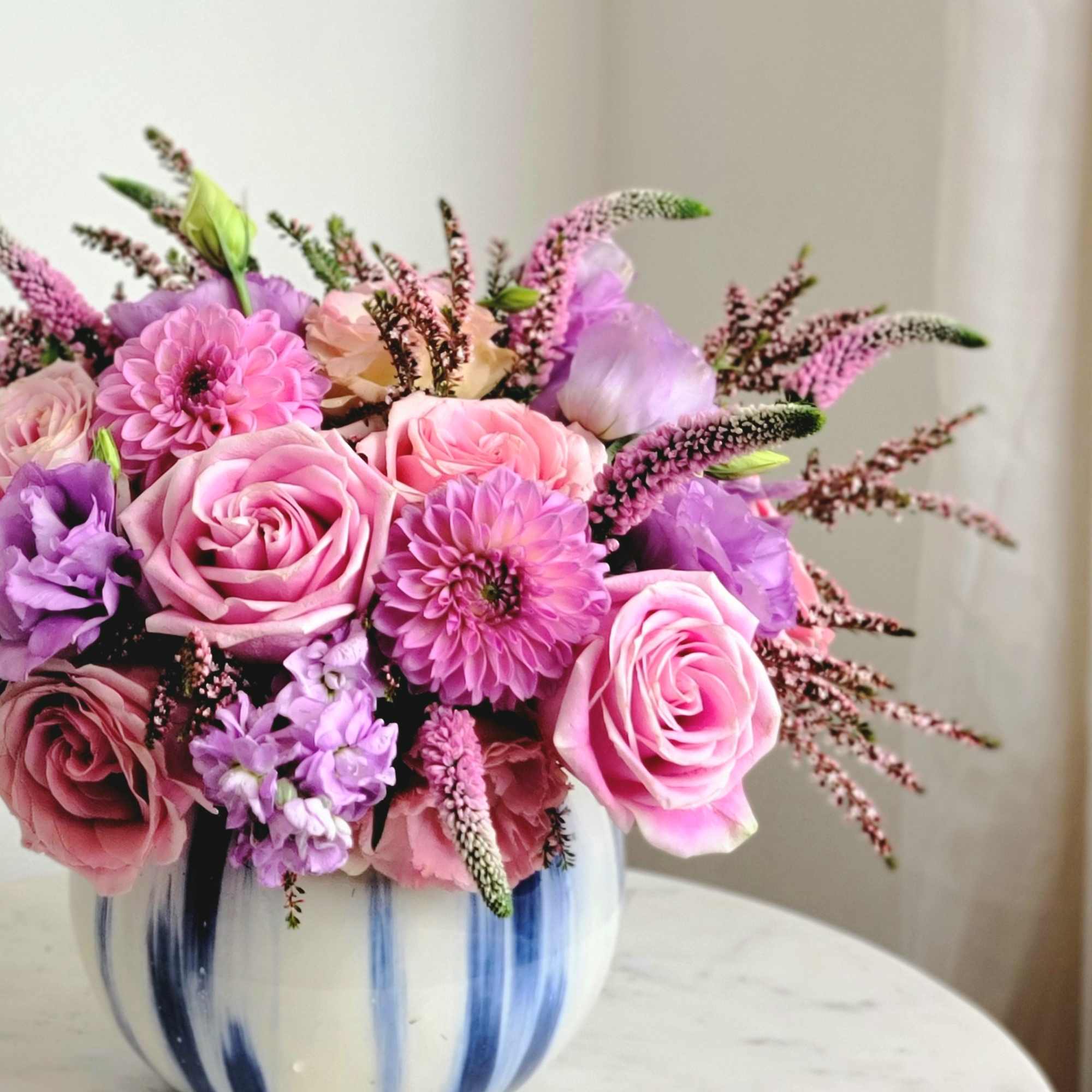 This arrangement in lavender shades looks elegant and romantic. Light lilac shades