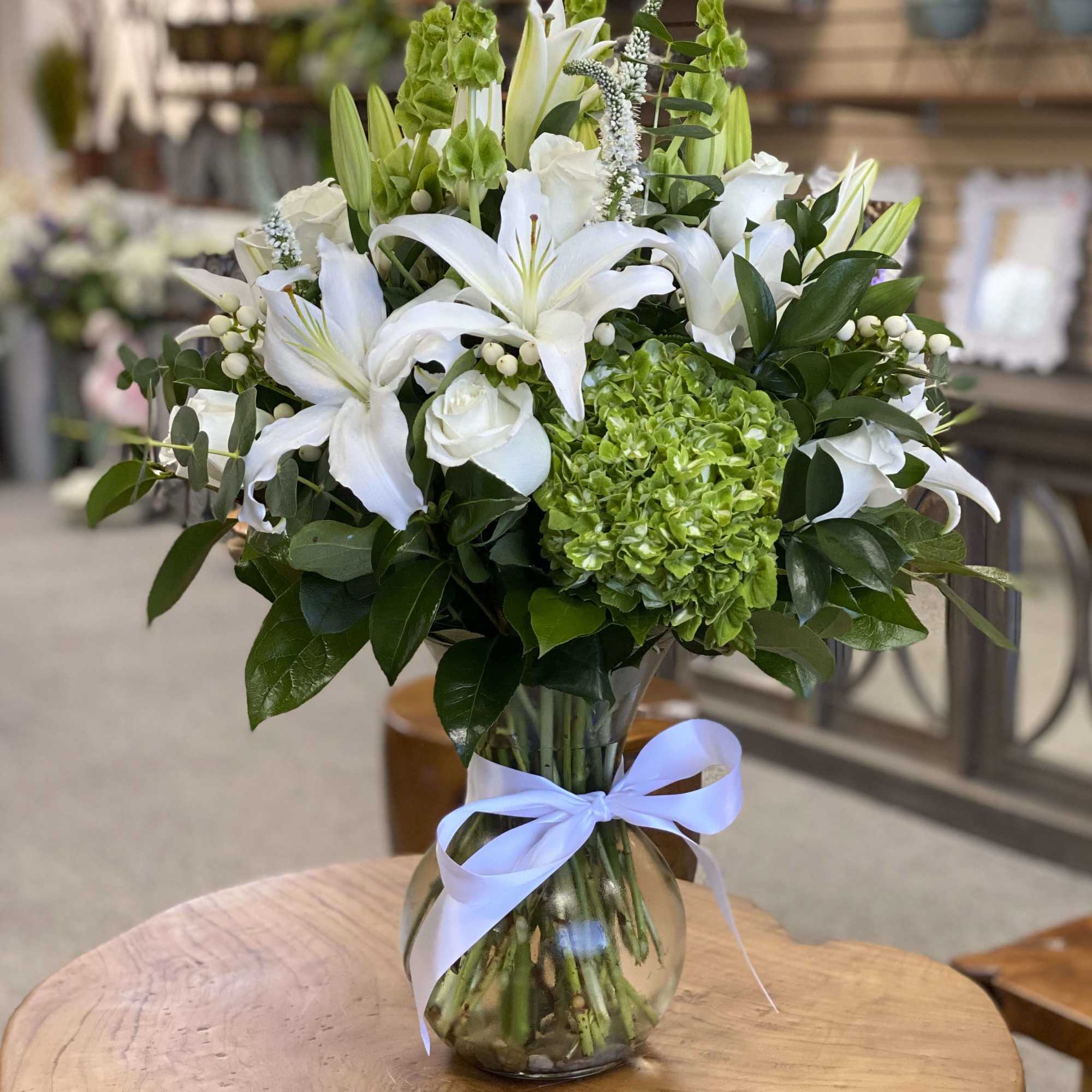 green hydrangea paired with white roses, lily&#039;s high quality greenery. create an