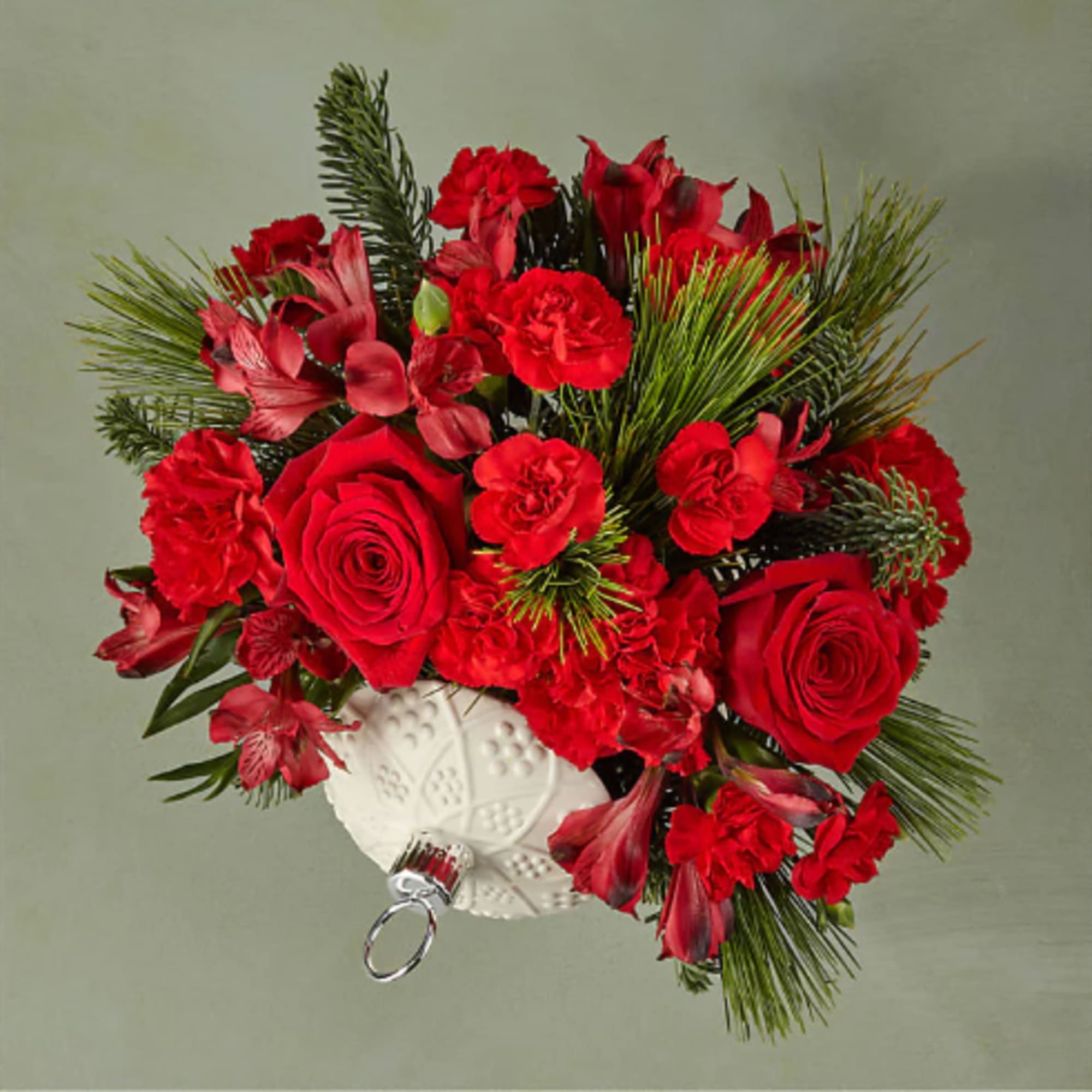 Bursting holiday spirit is elegantly symbolized in this deep red bouquet, where Bursting holiday spirit is elegantly symbolized in this deep red bouquet, where