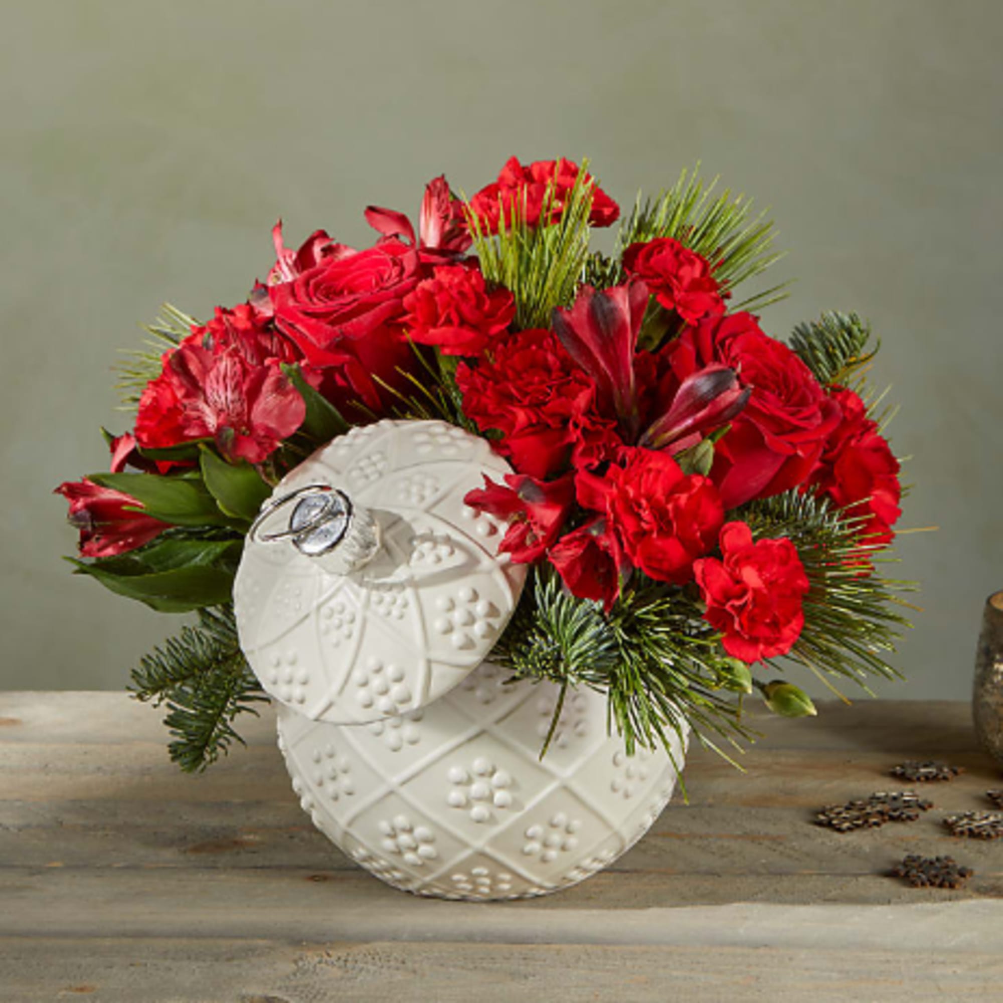 Bursting holiday spirit is elegantly symbolized in this deep red bouquet, where Bursting holiday spirit is elegantly symbolized in this deep red bouquet, where