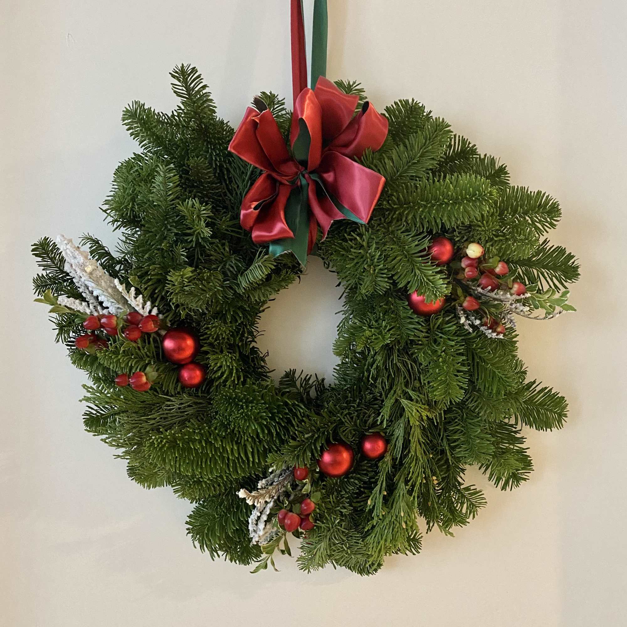 Deck the halls in classic Christmas style! Our traditional wreath is crafted Deck the halls in classic Christmas style! Our traditional wreath is crafted