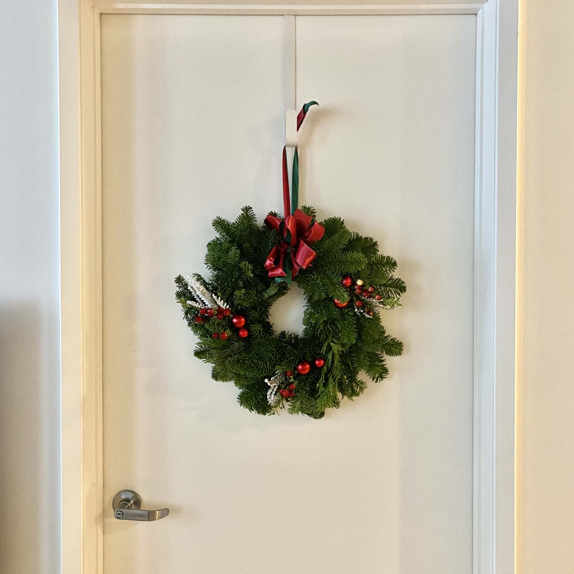 Deck the halls in classic Christmas style! Our traditional wreath is crafted Deck the halls in classic Christmas style! Our traditional wreath is crafted