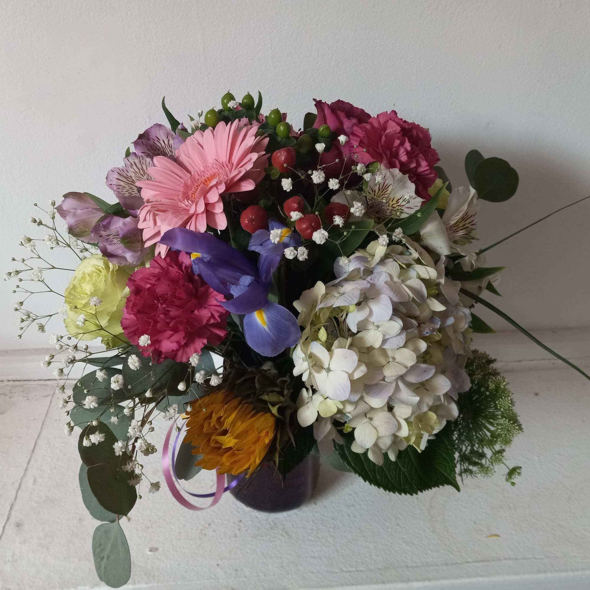 Artistic mix of varied flowers sprinkled with babith breath 