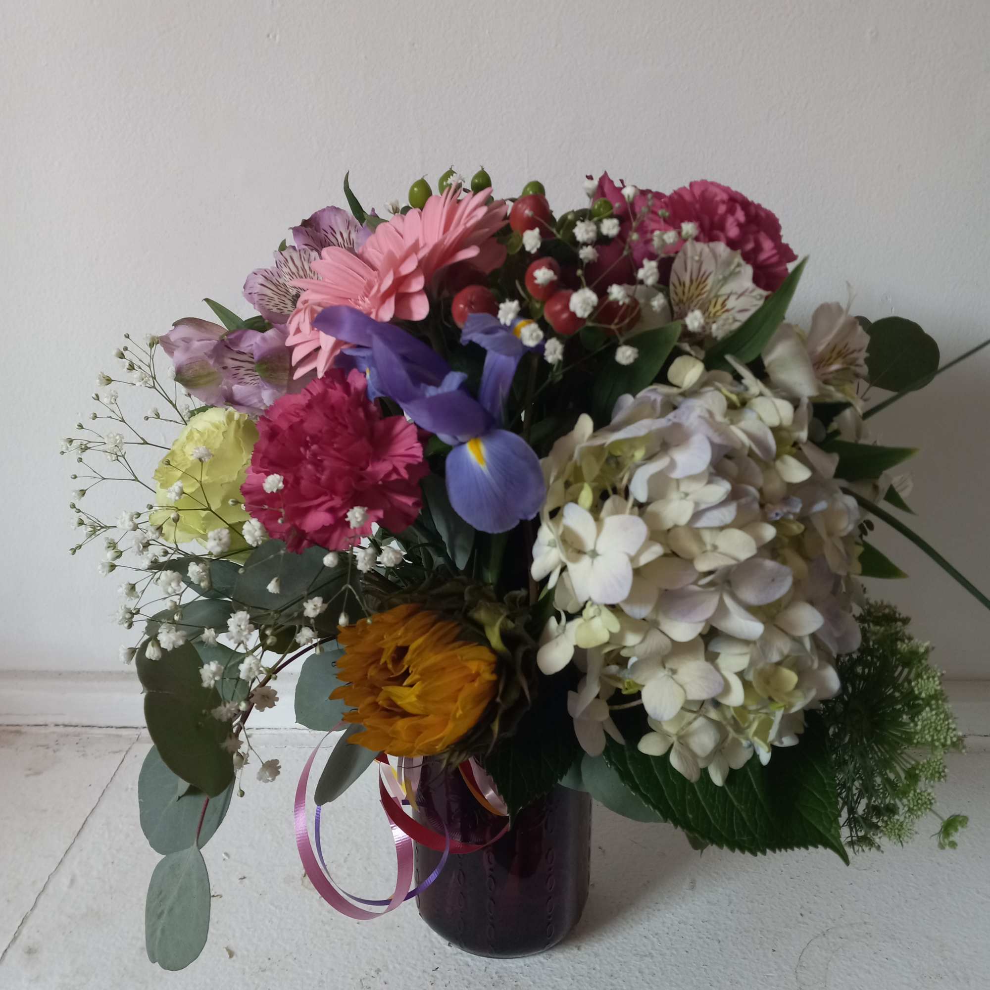 Artistic mix of varied flowers sprinkled with babith breath 