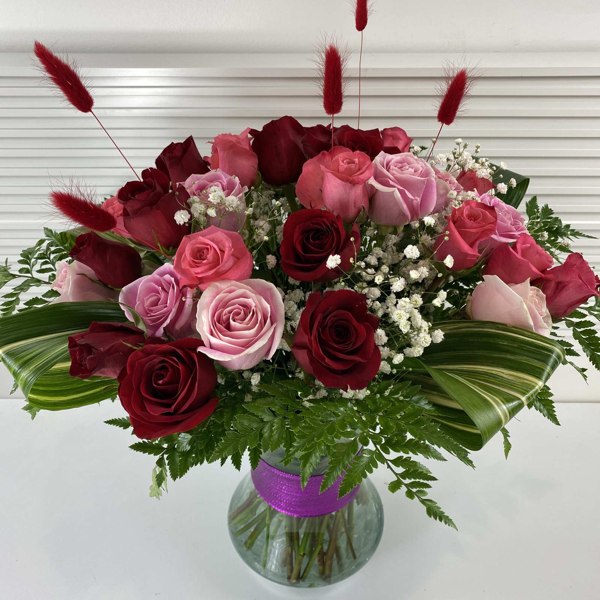 A rich mix of 2 dozen red roses and 1 dozen pink
