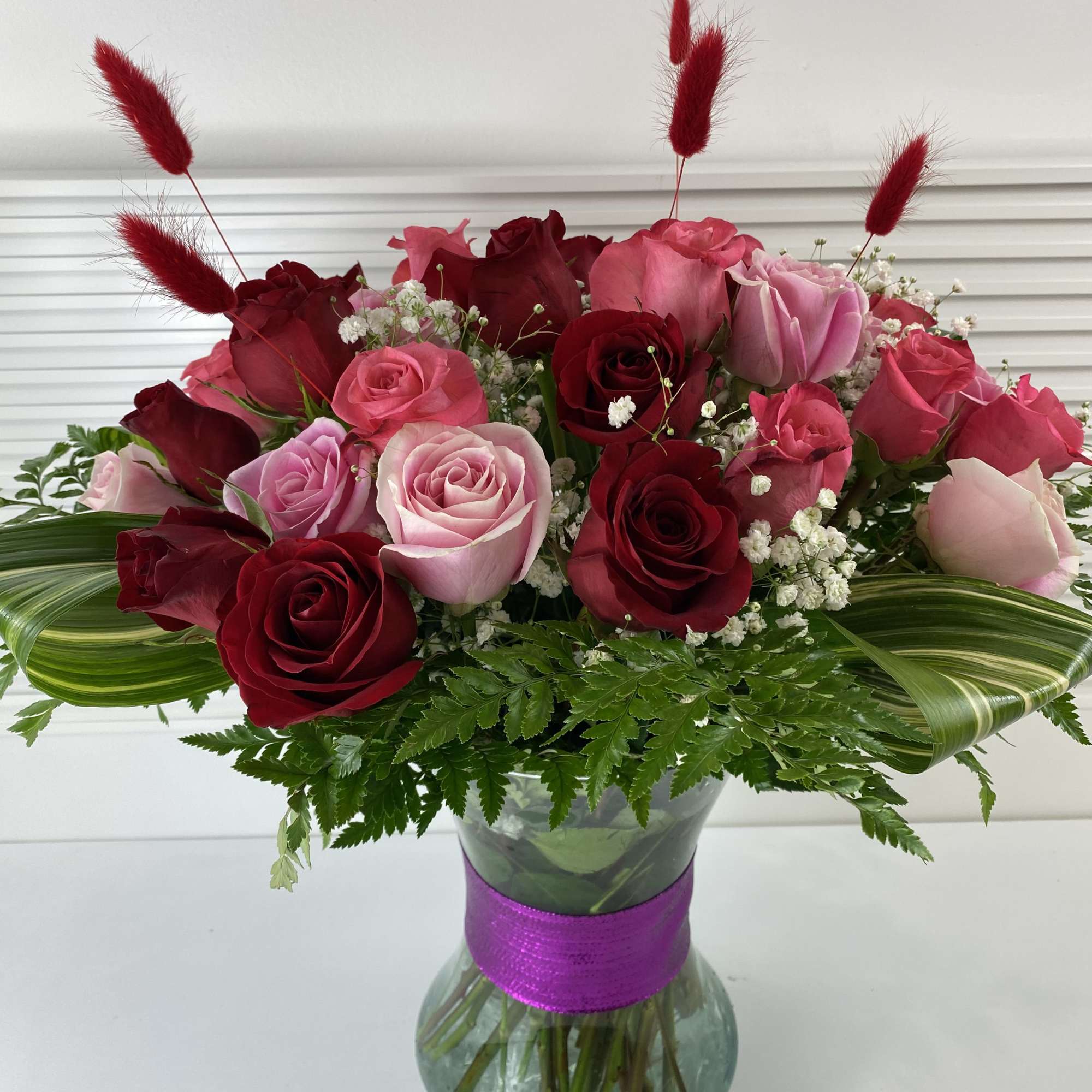 A rich mix of 2 dozen red roses and 1 dozen pink
