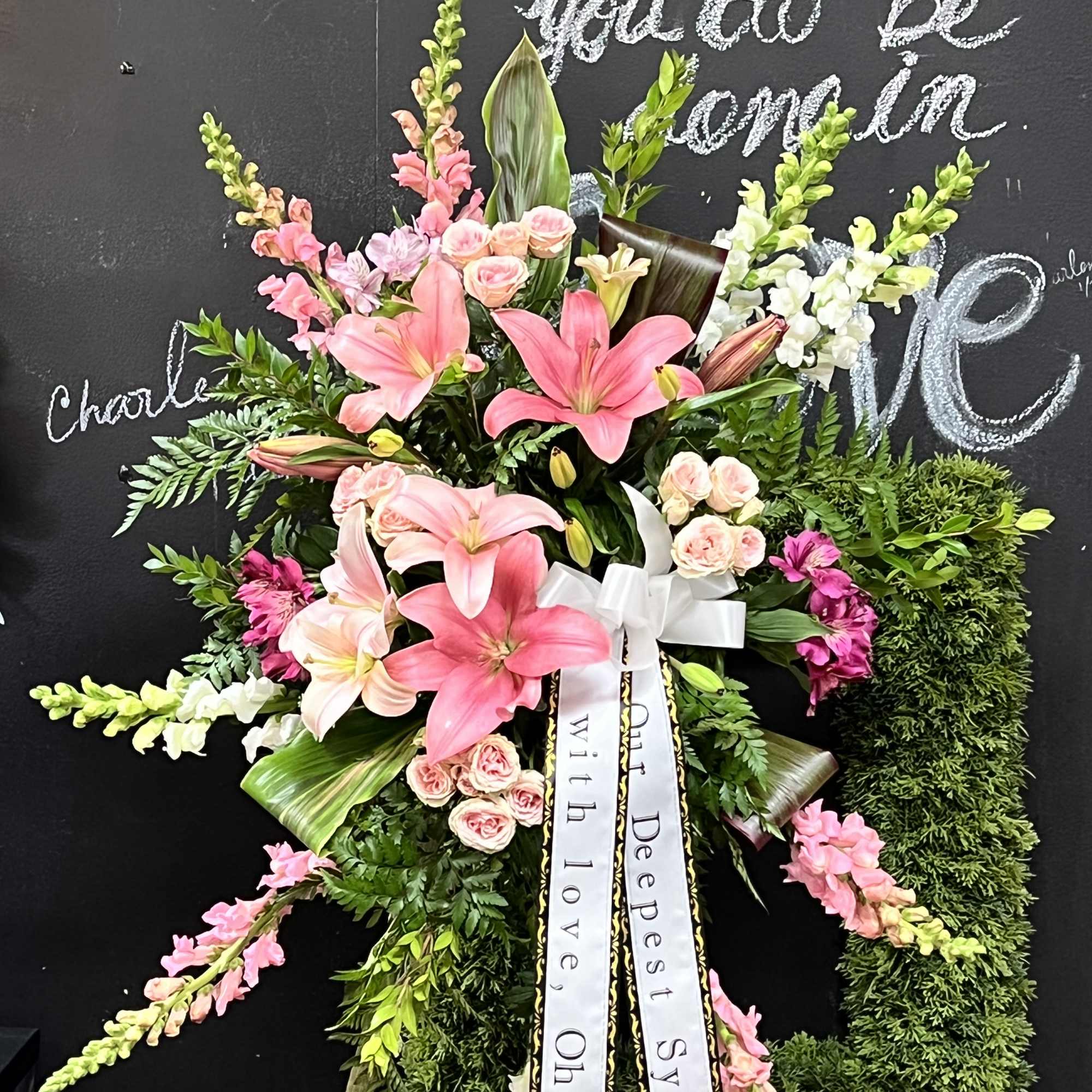 Most popular Sympathy Standing Spray with message on the banner