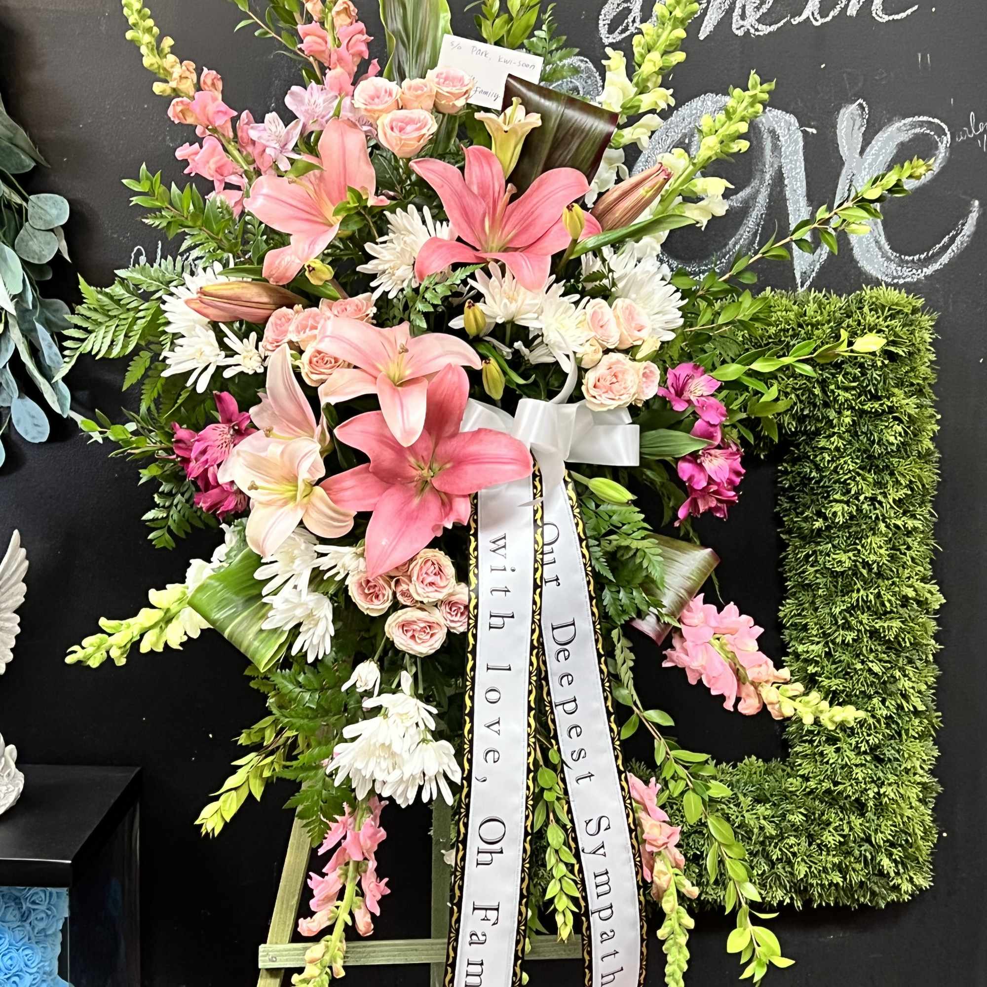 Most popular Sympathy Standing Spray with message on the banner