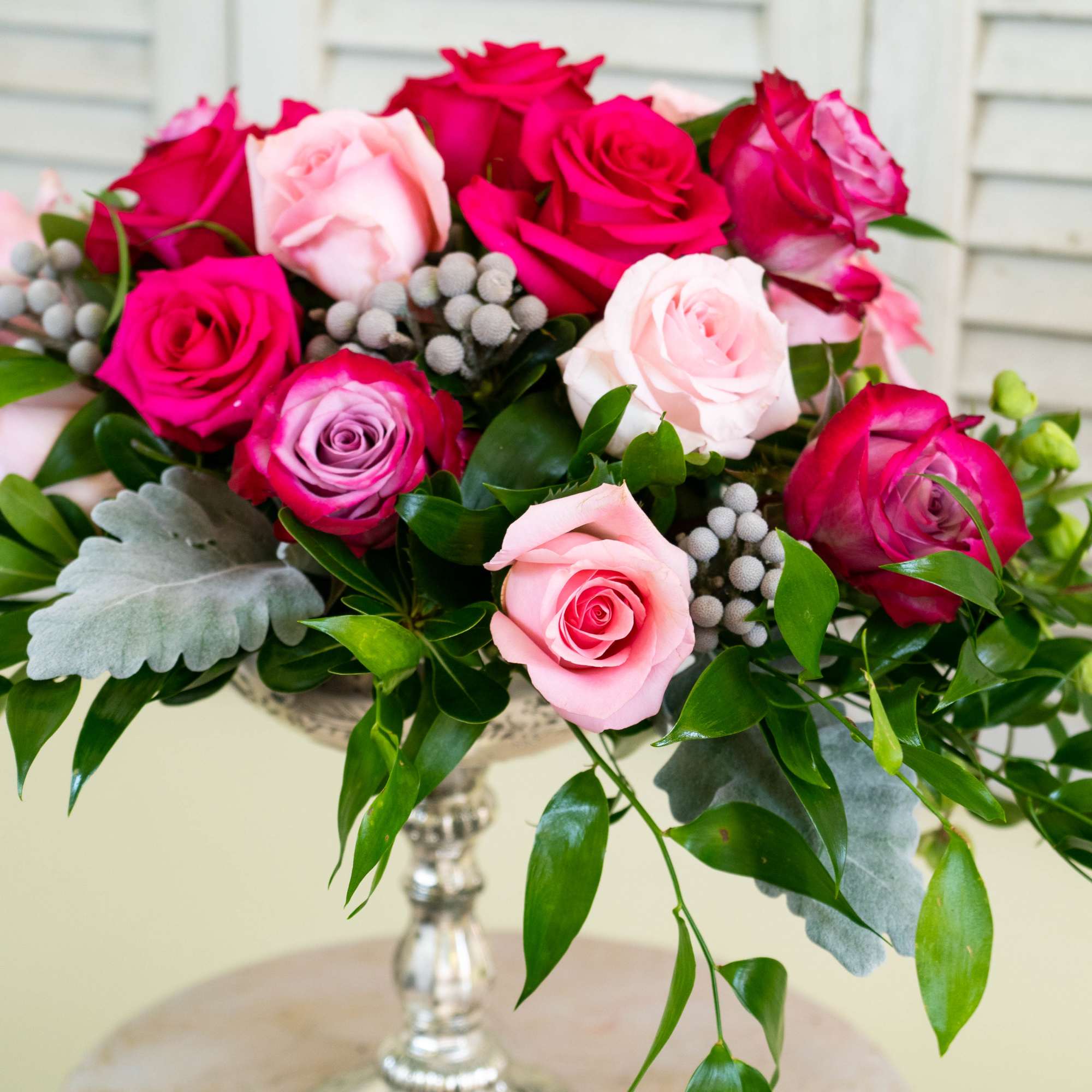 A stunning dozen and a half roses featured in a stunning, tall A stunning dozen and a half roses featured in a stunning, tall