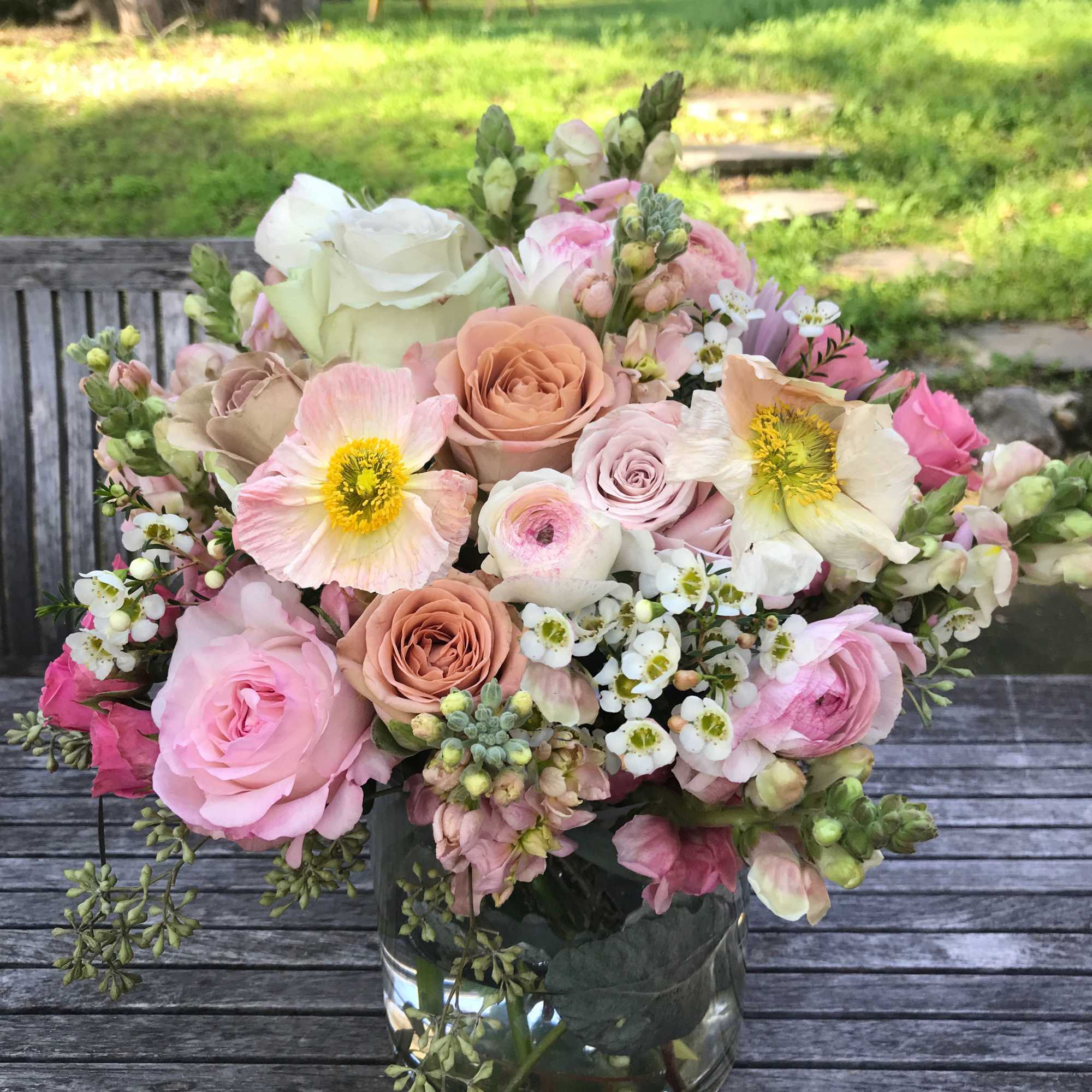 Natural and organic garden like arrangement of seasonal light pastel flowers, always Natural and organic garden like arrangement of seasonal light pastel flowers, always