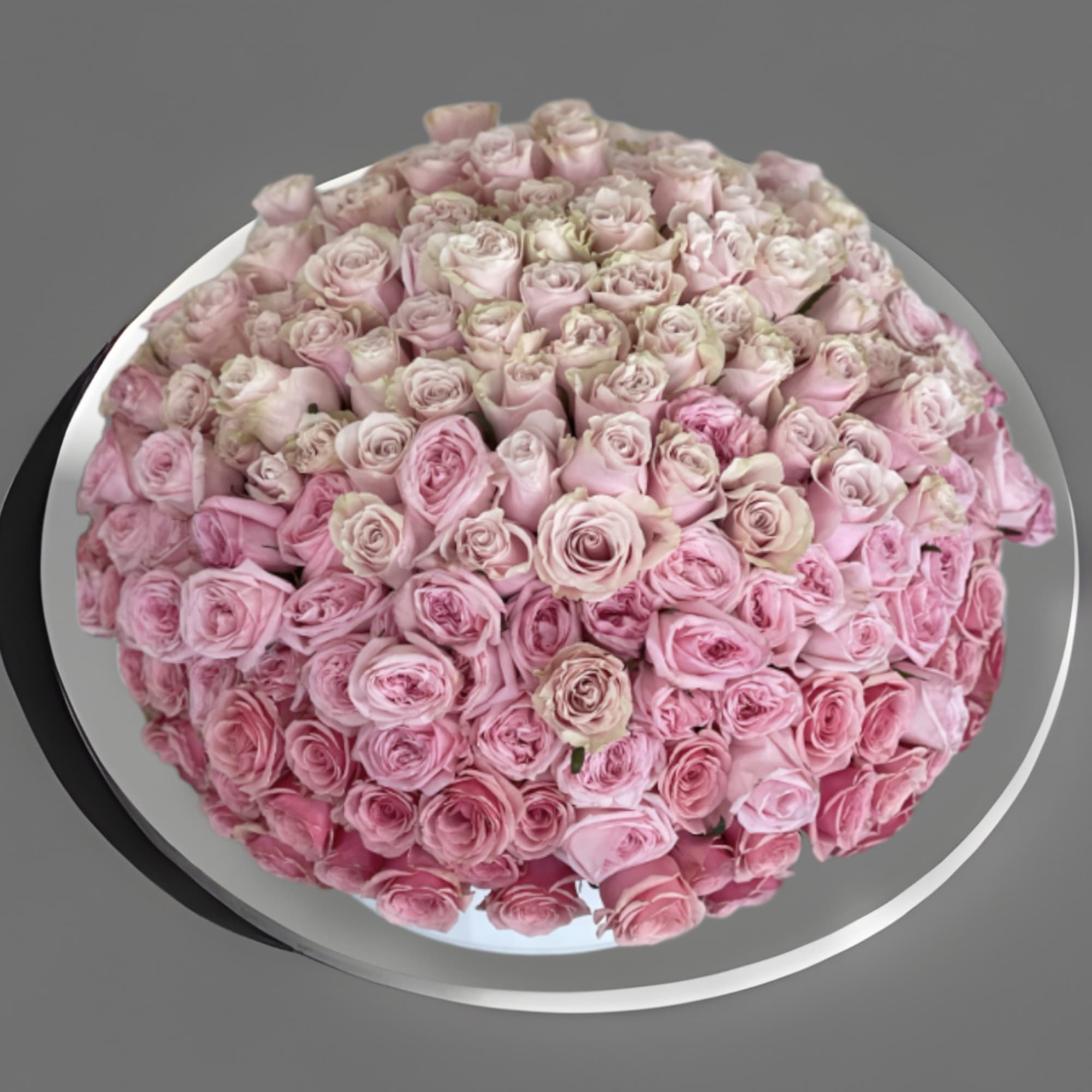 This arrangement comes in a round clay vase filled with filled with