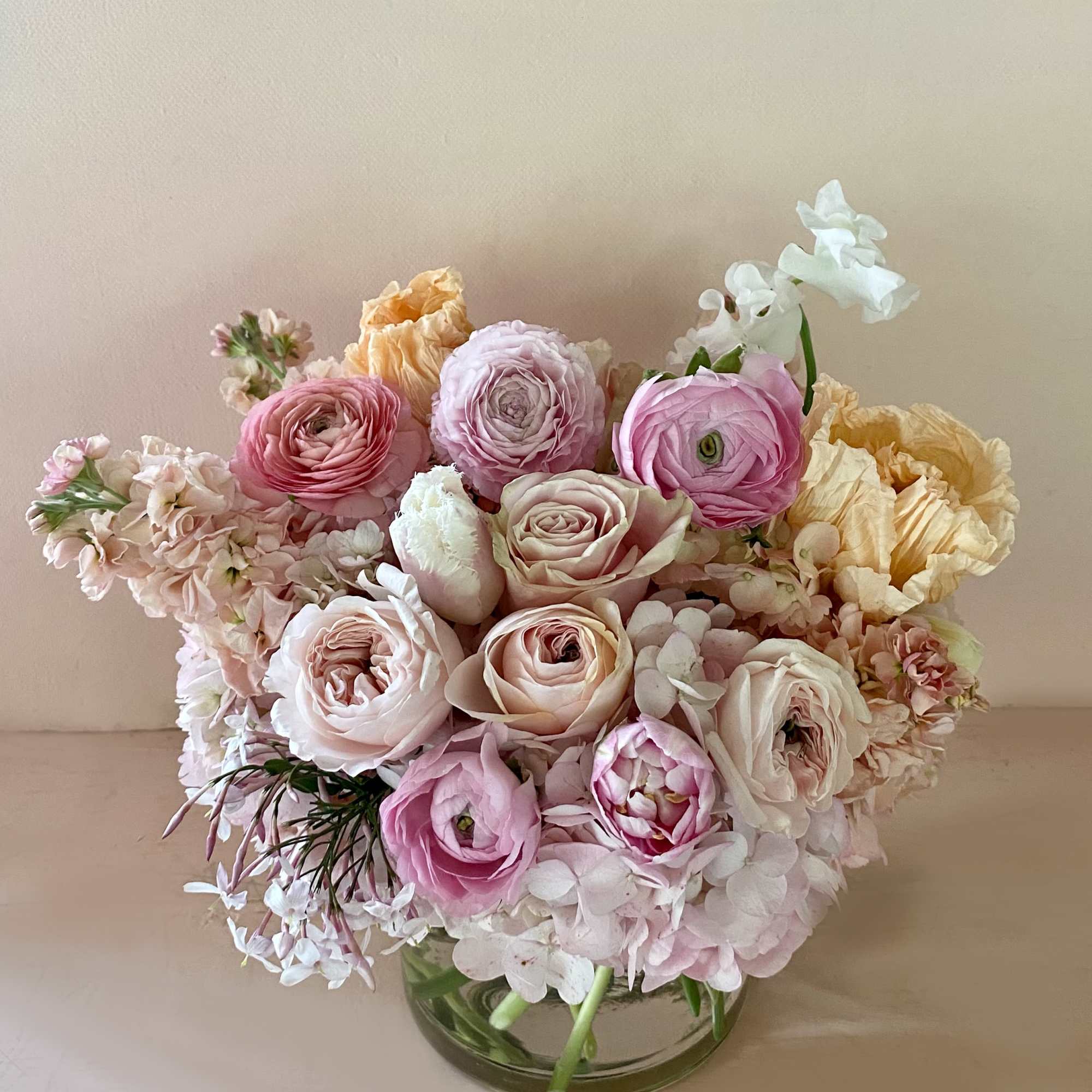 Get a beautiful, fresh medium sized Blomst arrangement of seasonal pastels or Get a beautiful, fresh medium sized Blomst arrangement of seasonal pastels or