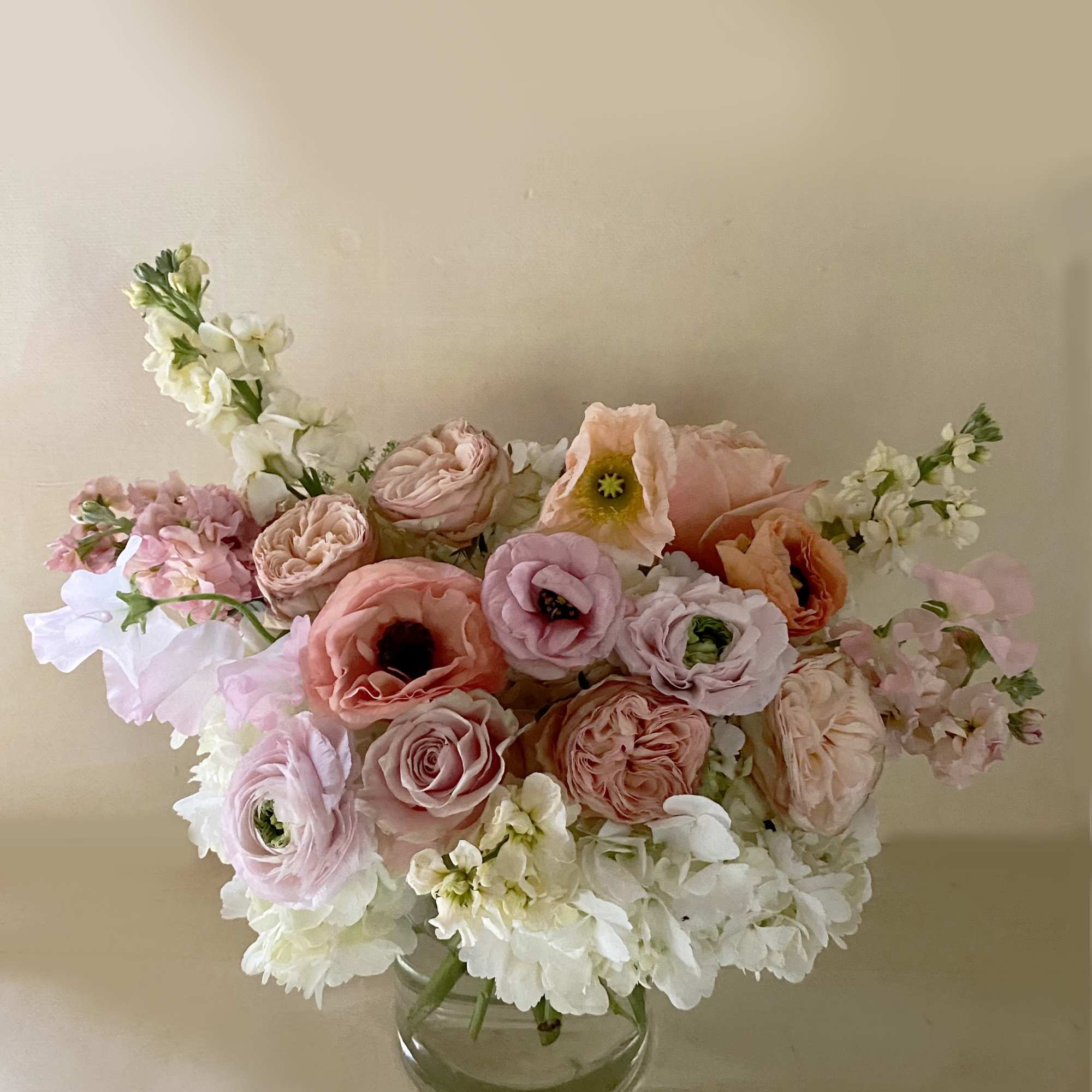 Get a beautiful, fresh medium sized Blomst arrangement of seasonal pastels or Get a beautiful, fresh medium sized Blomst arrangement of seasonal pastels or