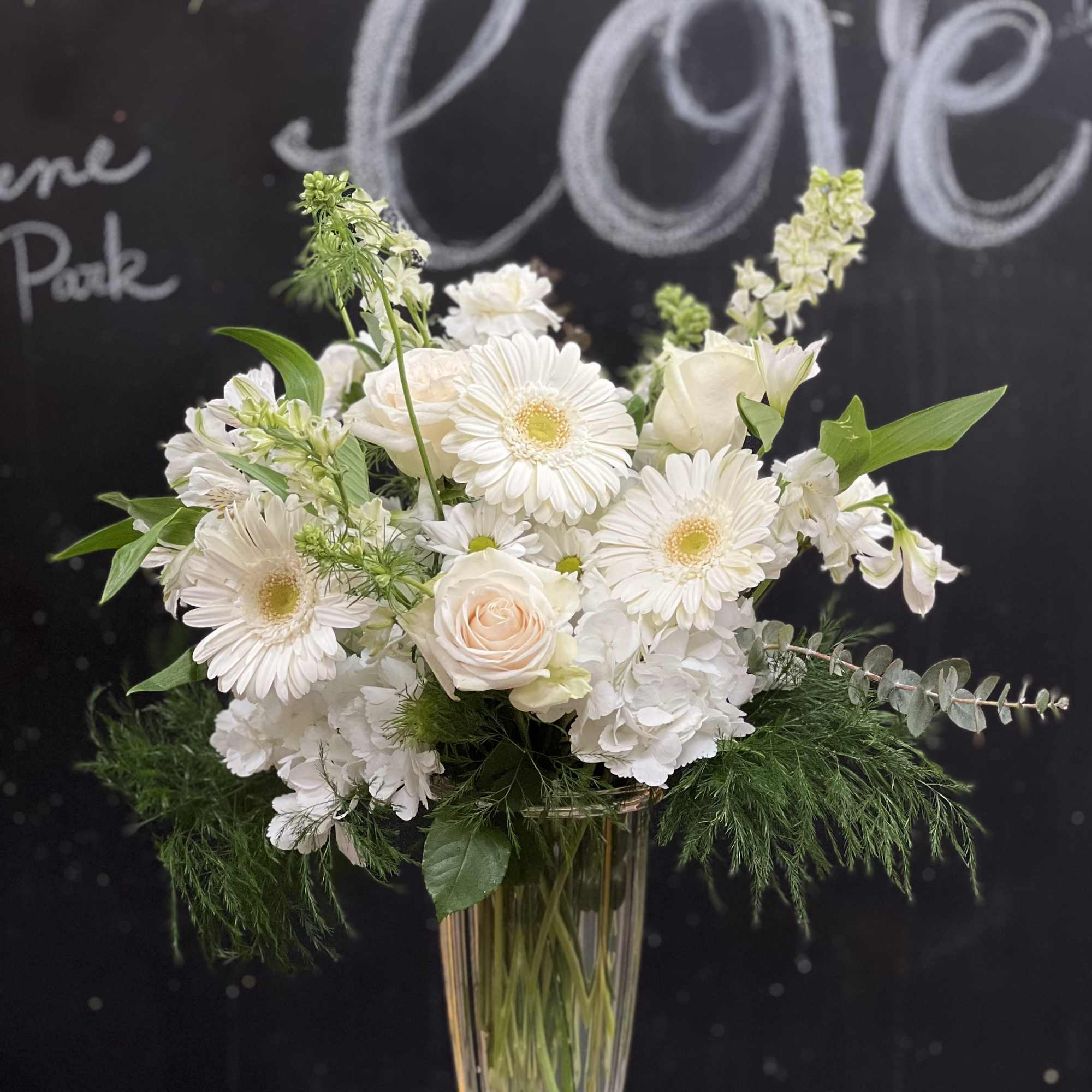 Our Alluring Elegance Bouquet is a striking array of ivory and green.