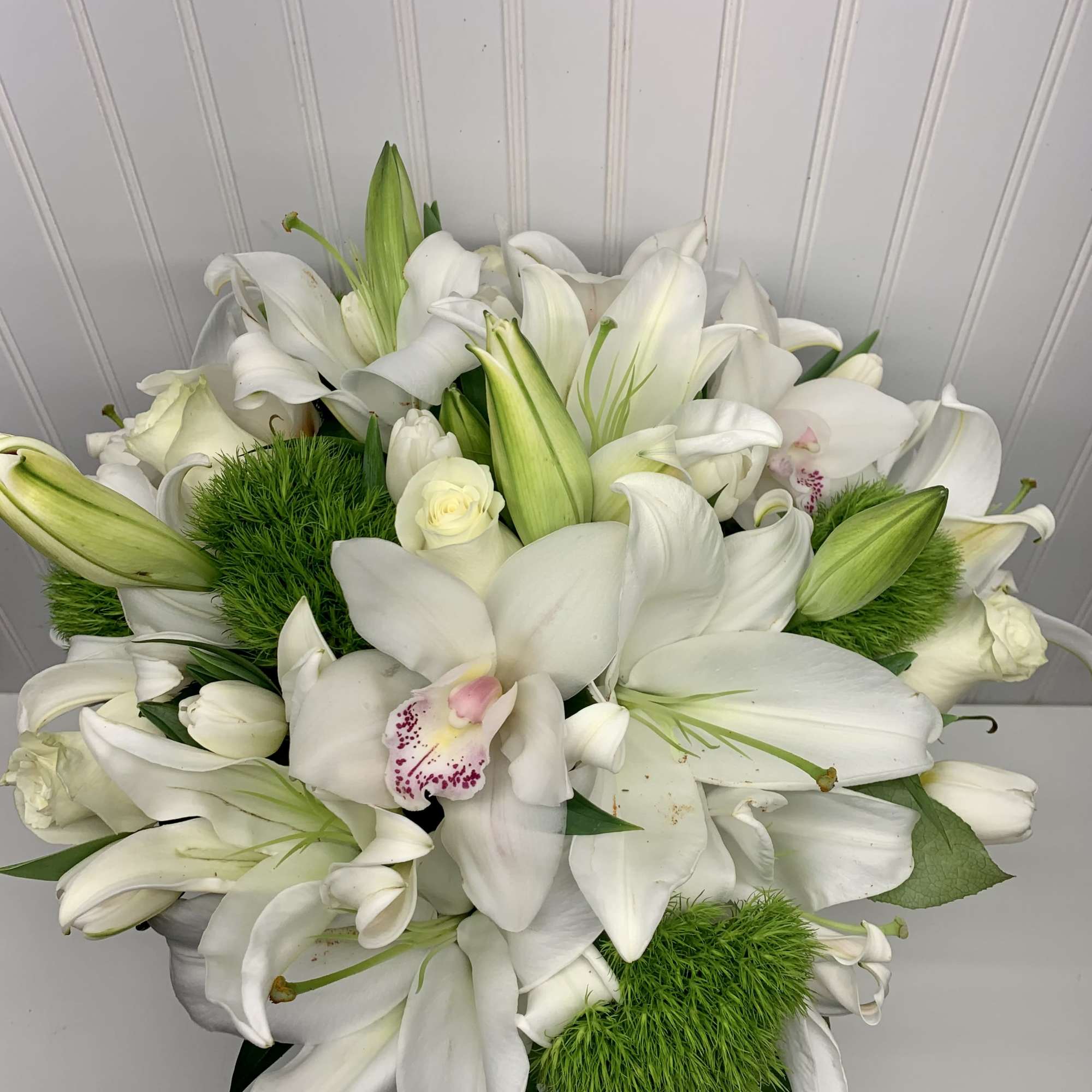 Like a vacation for the senses this lovely bouquet delivers an oasis