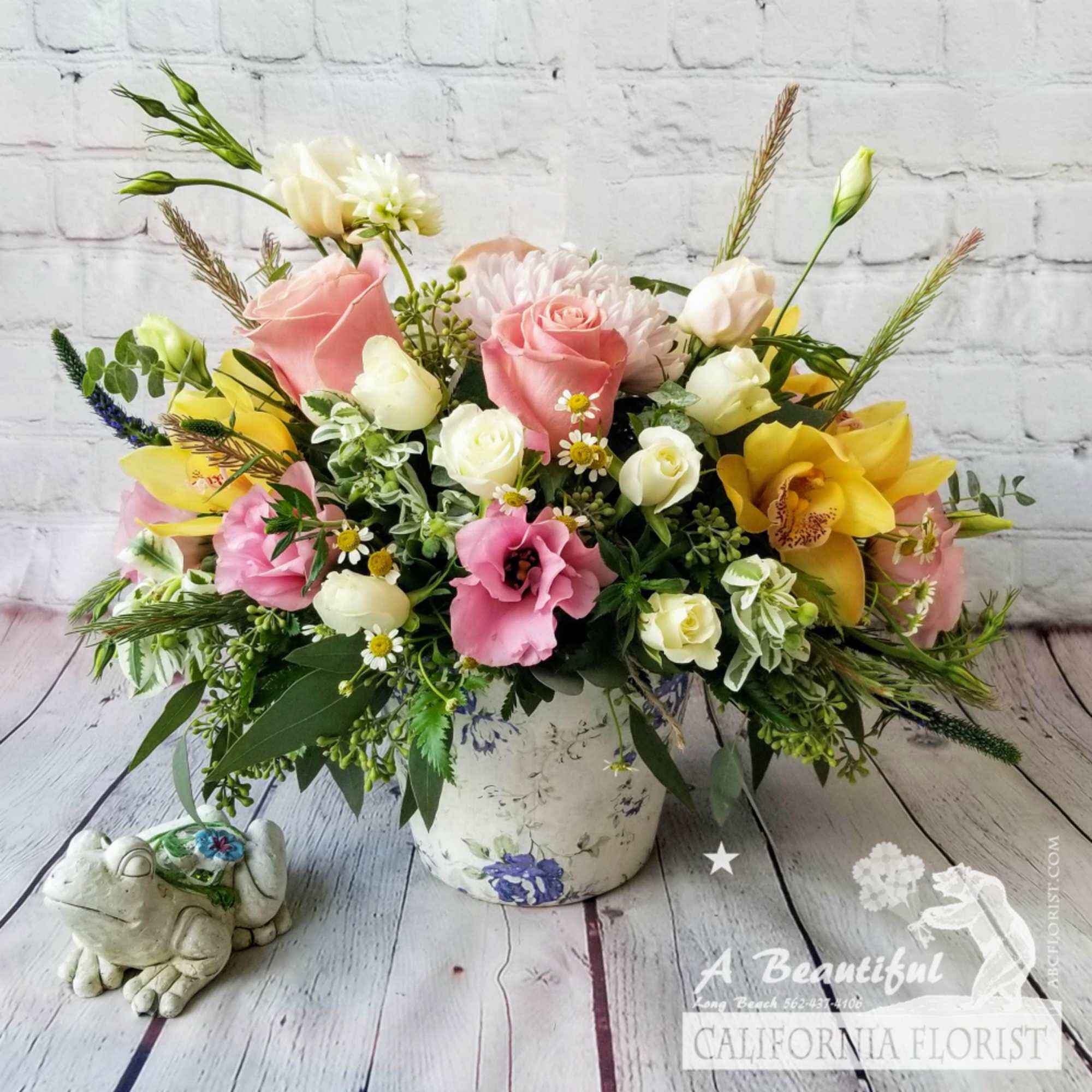Long Beach Garden arrangement, our floral artisan selects the freshest blooms of