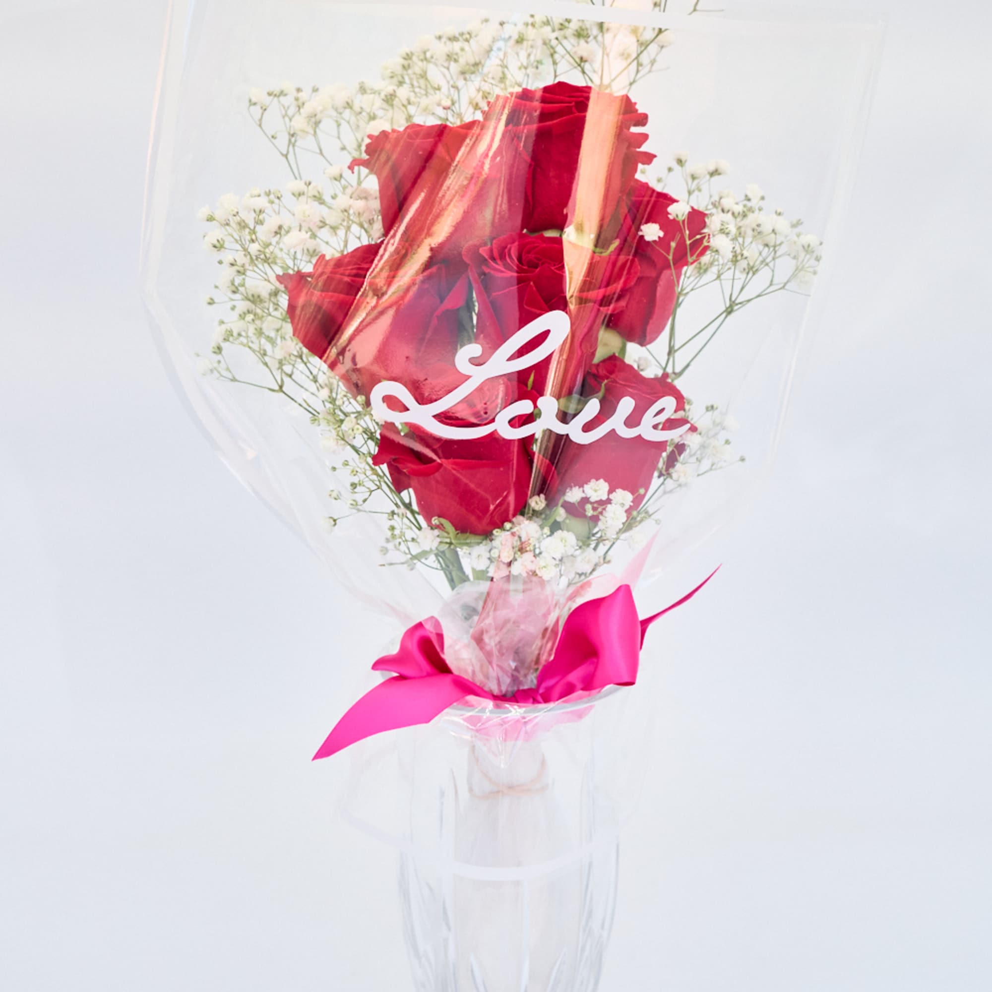 Red Roses with Baby's Breath bouquet.
Wrapped in a clear "Love" print cellophane.
Tied Red Roses with Baby's Breath bouquet.
Wrapped in a clear "Love" print cellophane.
Tied