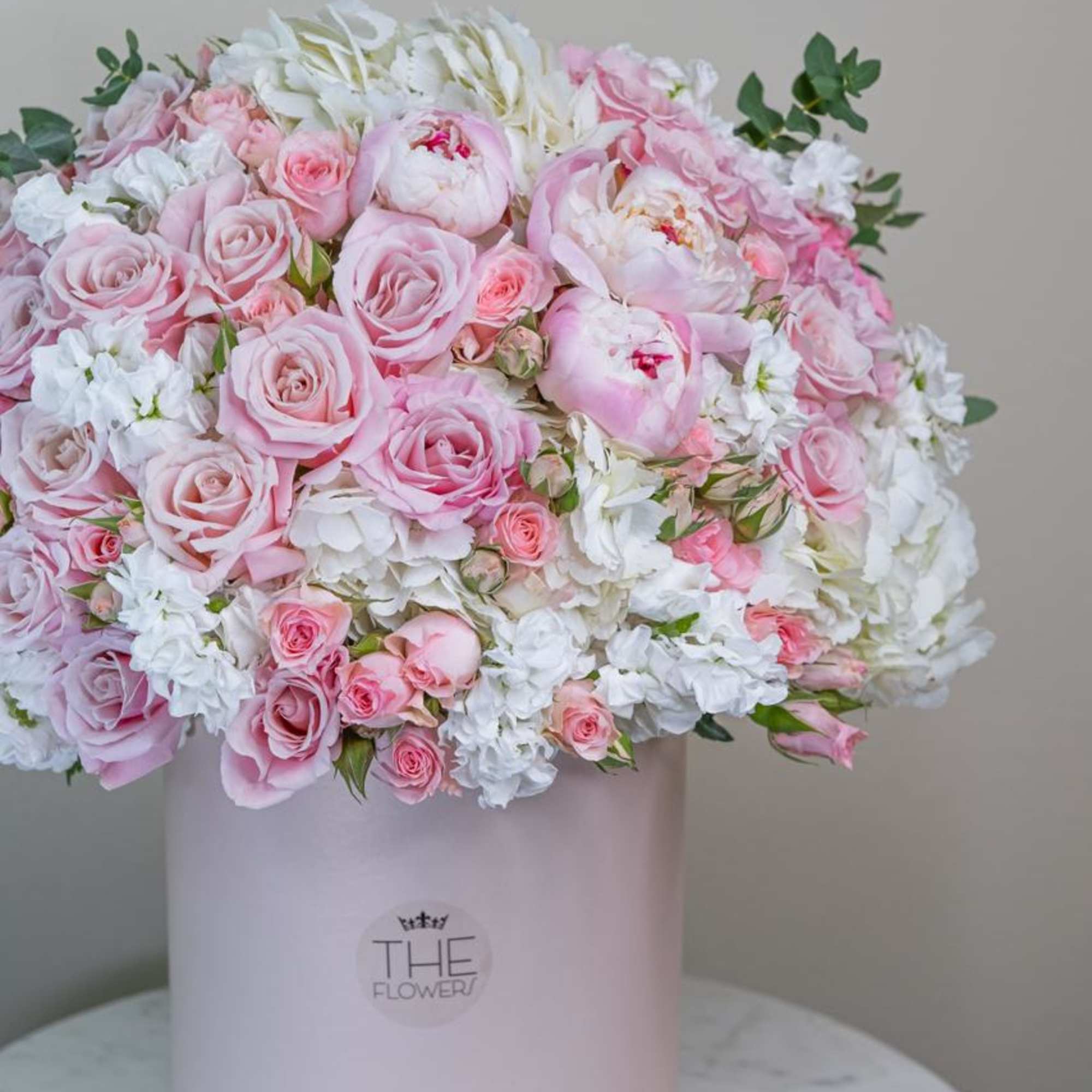 An incredibly soft and delicate combination of pink peonies, roses,  hydrangeas