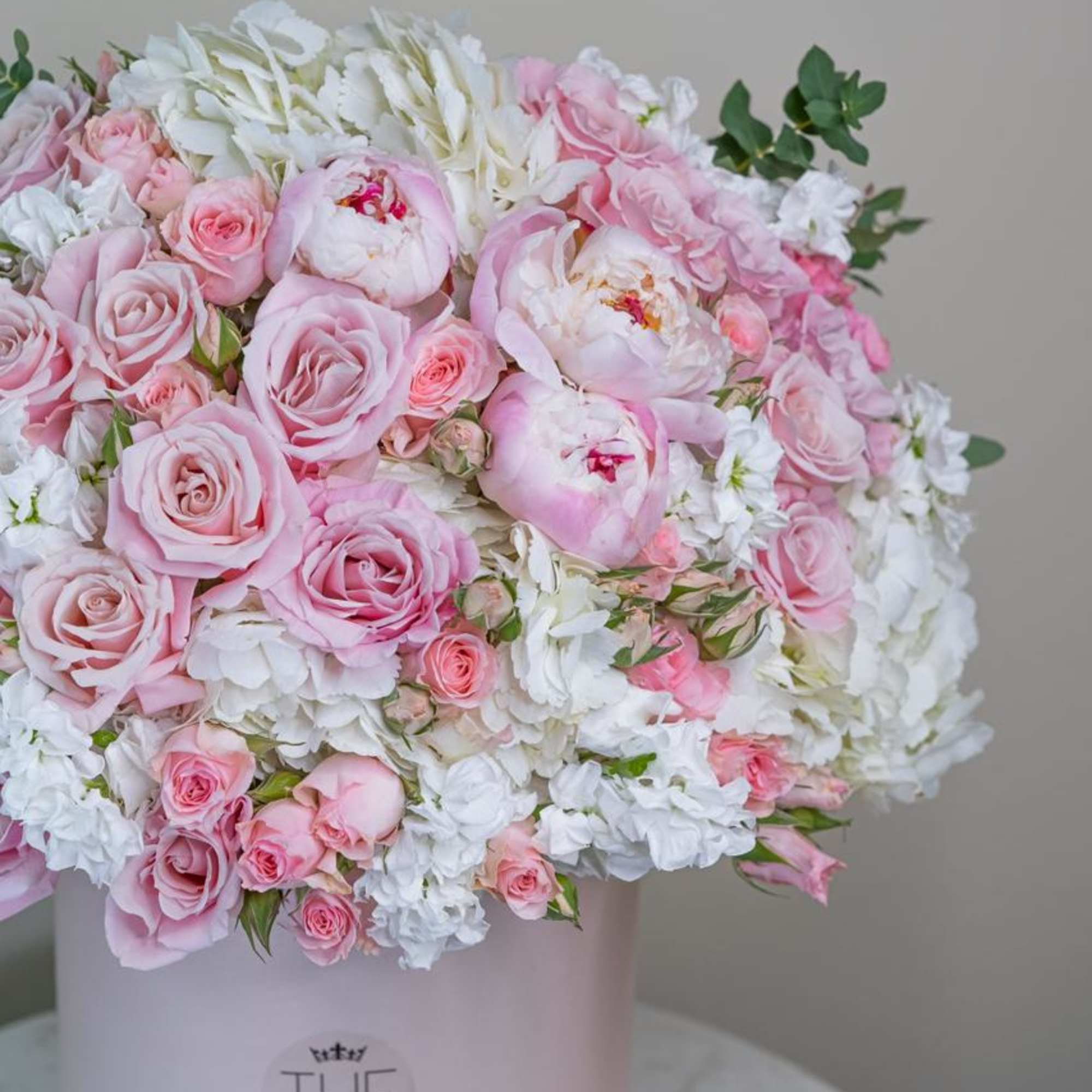 An incredibly soft and delicate combination of pink peonies, roses,  hydrangeas