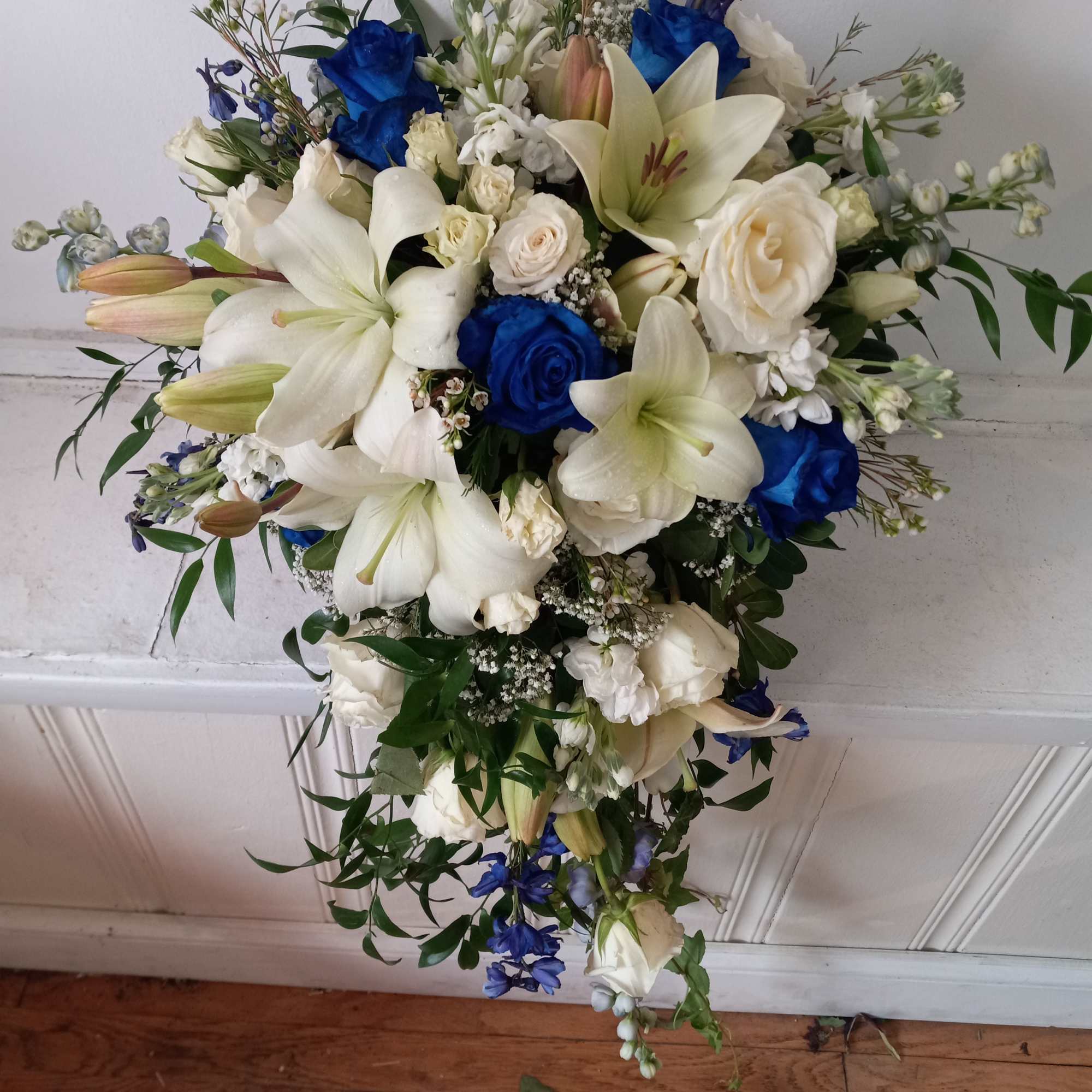 Beautiful white and navy- blue roses, white lilies, blue delphinium and white