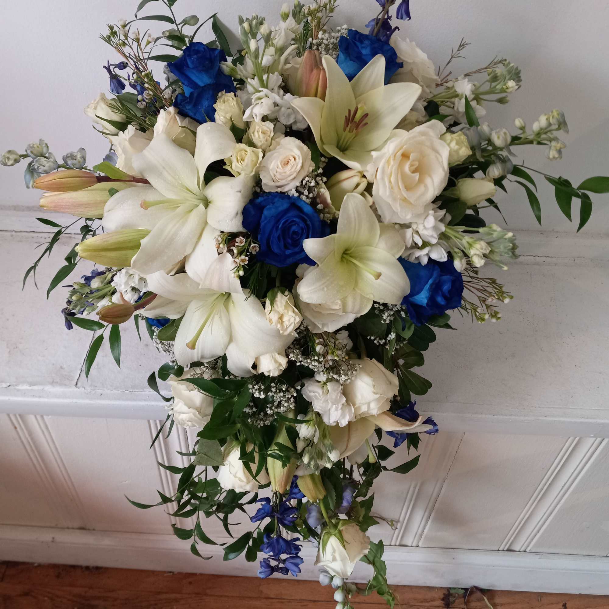Beautiful white and navy- blue roses, white lilies, blue delphinium and white