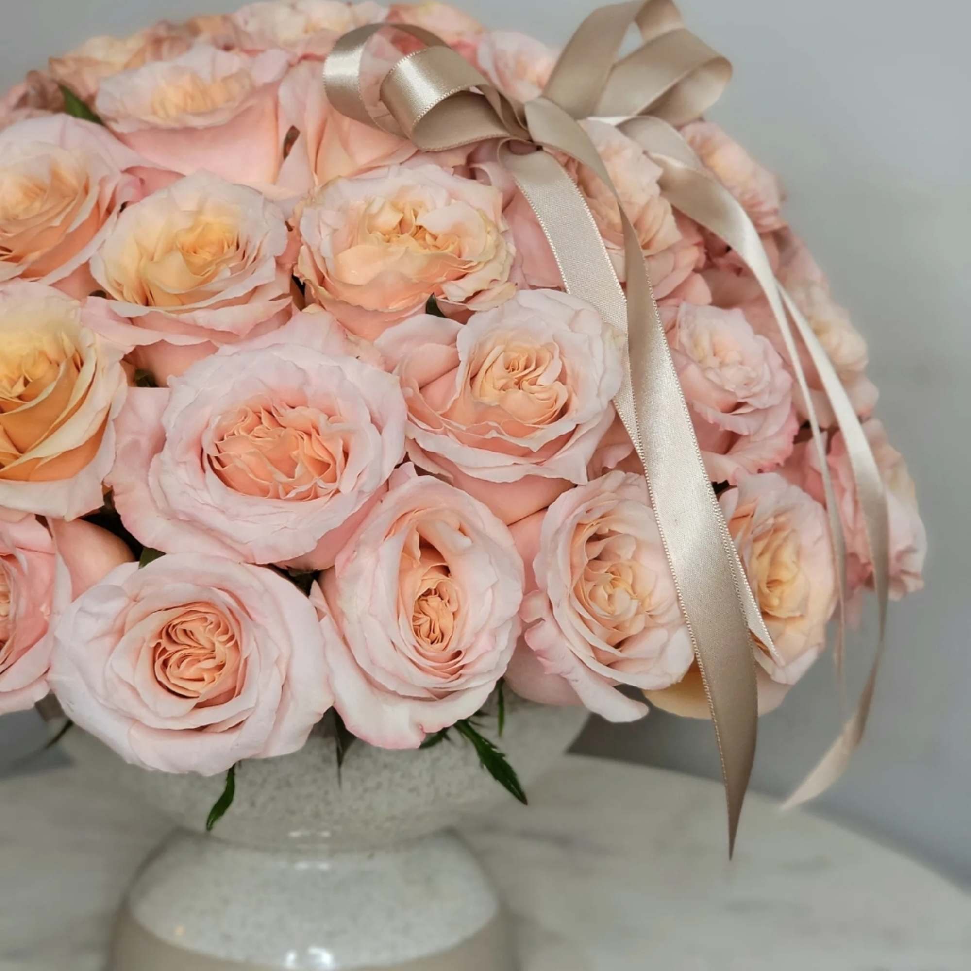 Peach roses are flowers of delicate and warm pink&ndash;orange colors, having an