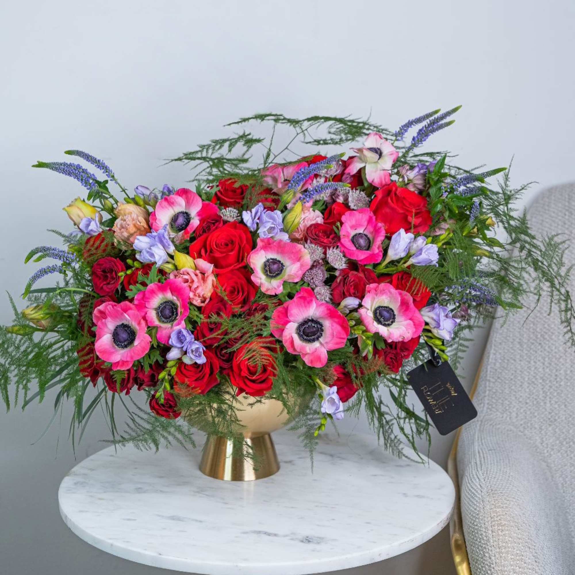 An arrangement in burgundy and saturated shades stands out for its depth