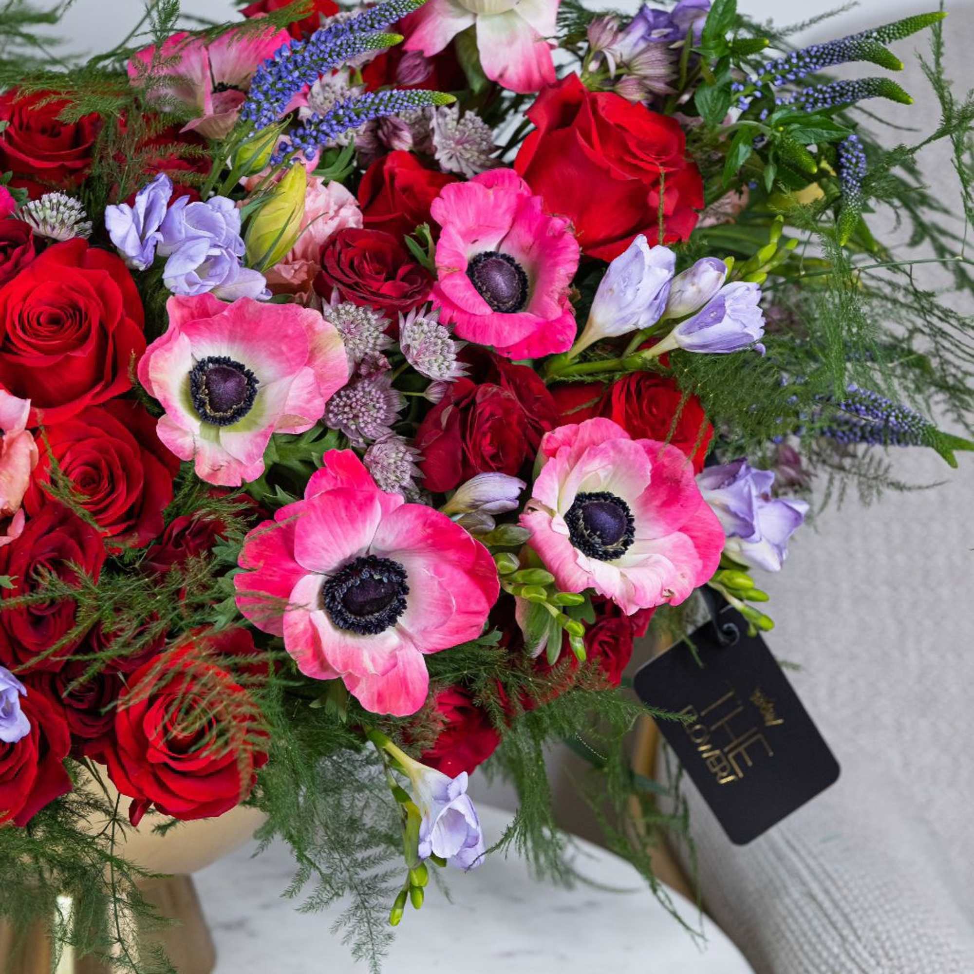 An arrangement in burgundy and saturated shades stands out for its depth