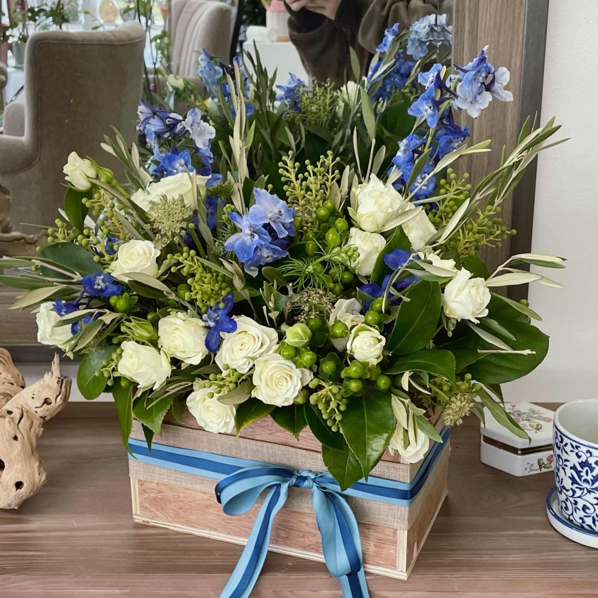 Blue-toned arrangement in a custom made wooden box. 