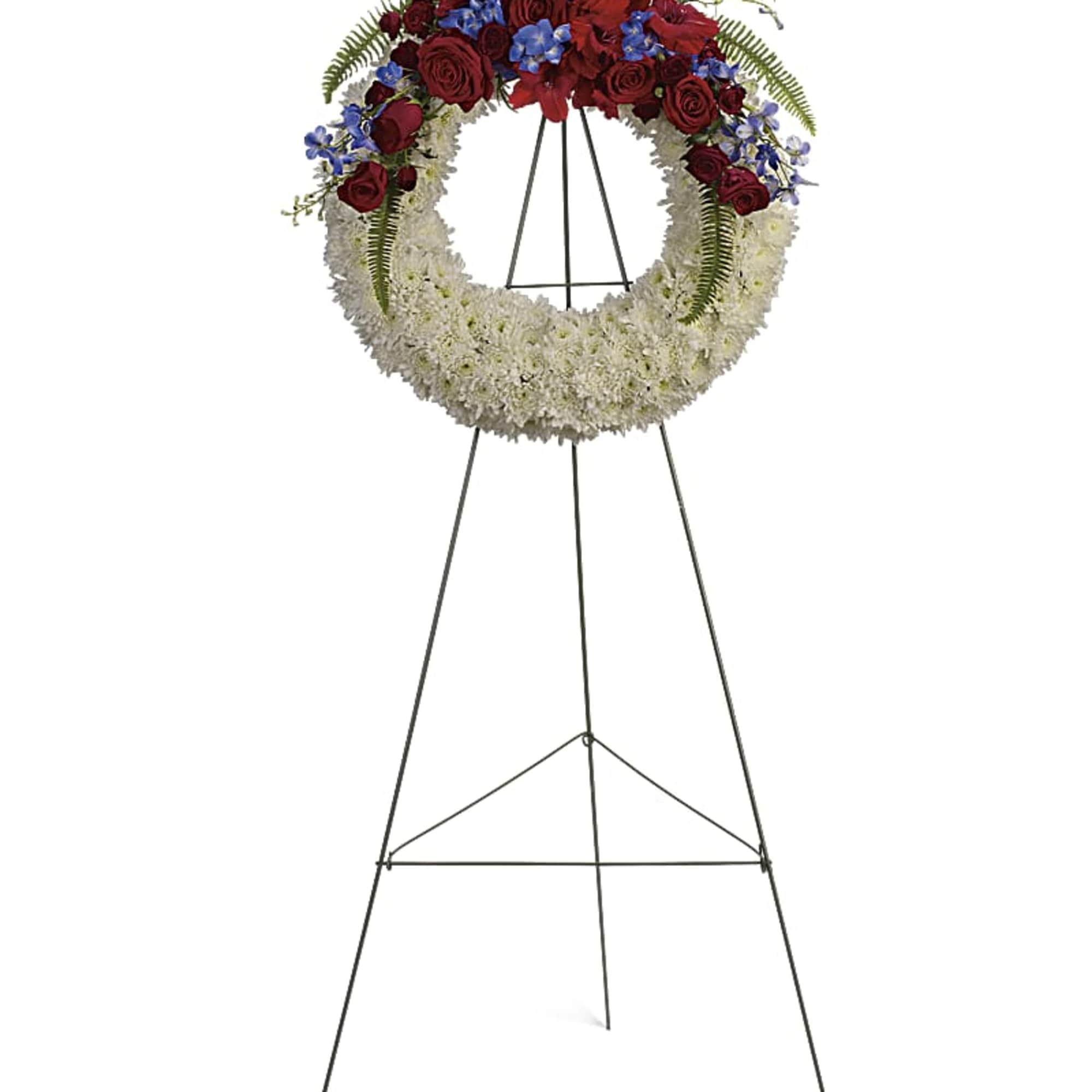 An elegant ring of serene white flowers topped with bold red and An elegant ring of serene white flowers topped with bold red and