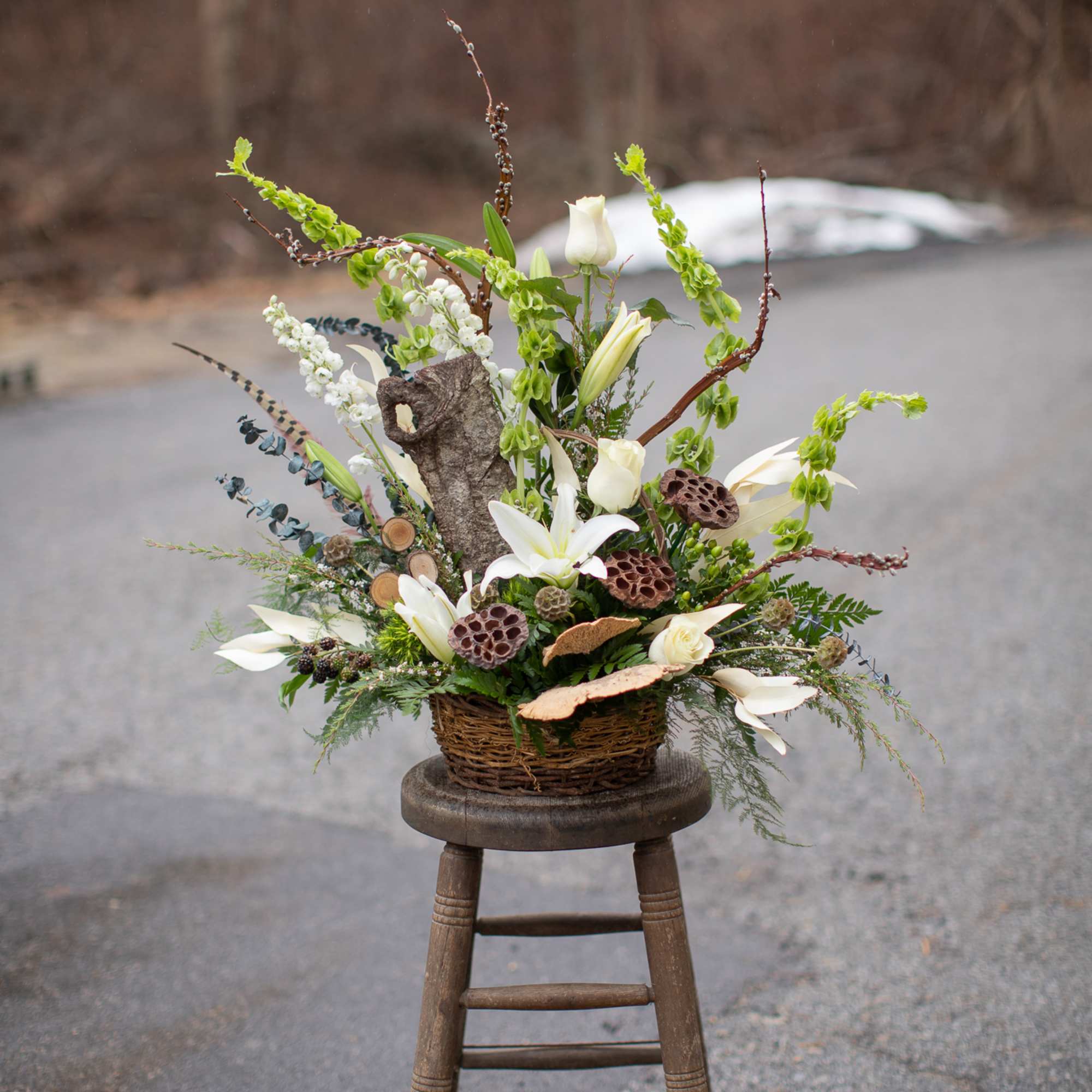 A woodland themed floral tribute perfectly suited for an avid outdoors person
