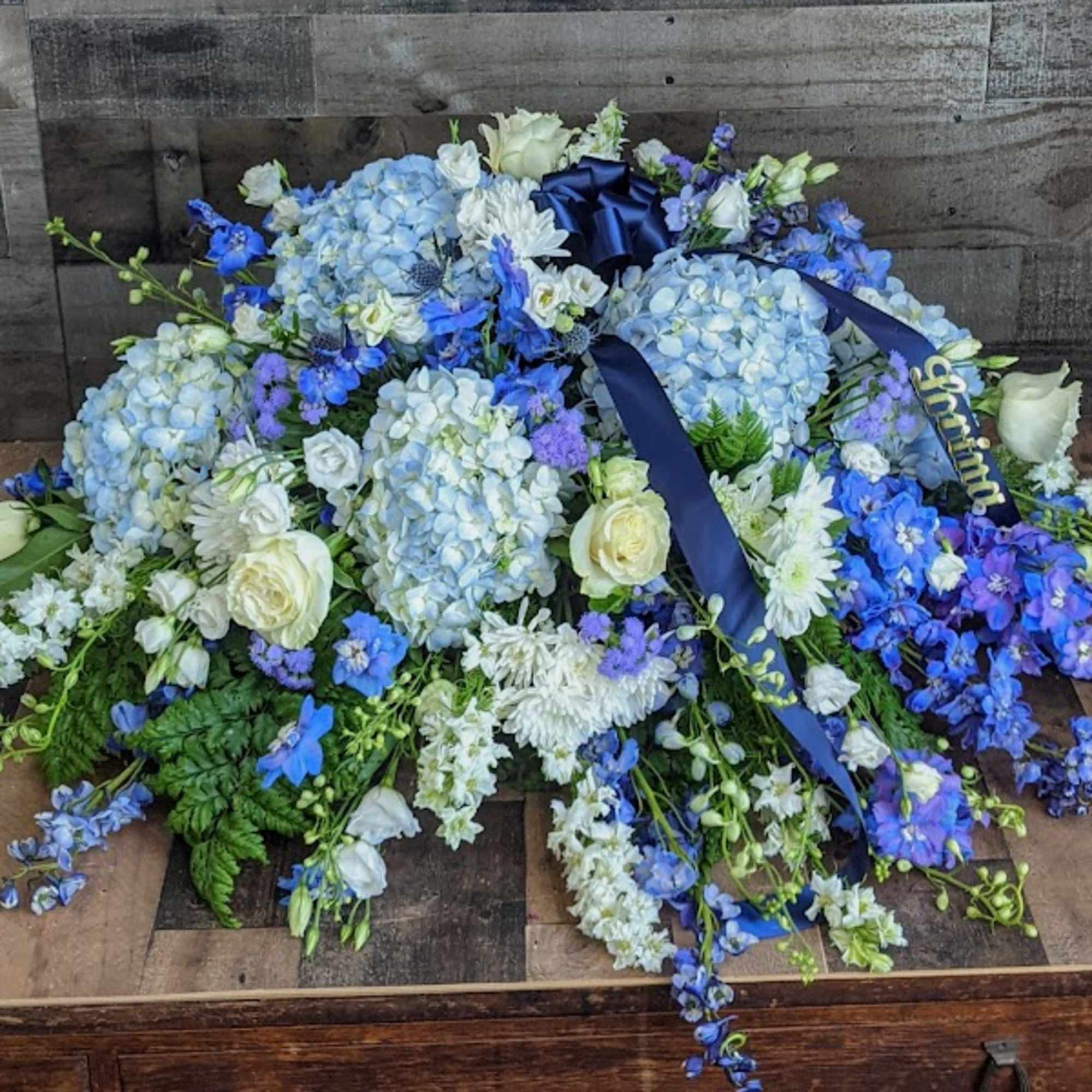 Sea of love Casket Sprayby Harrington Flowers