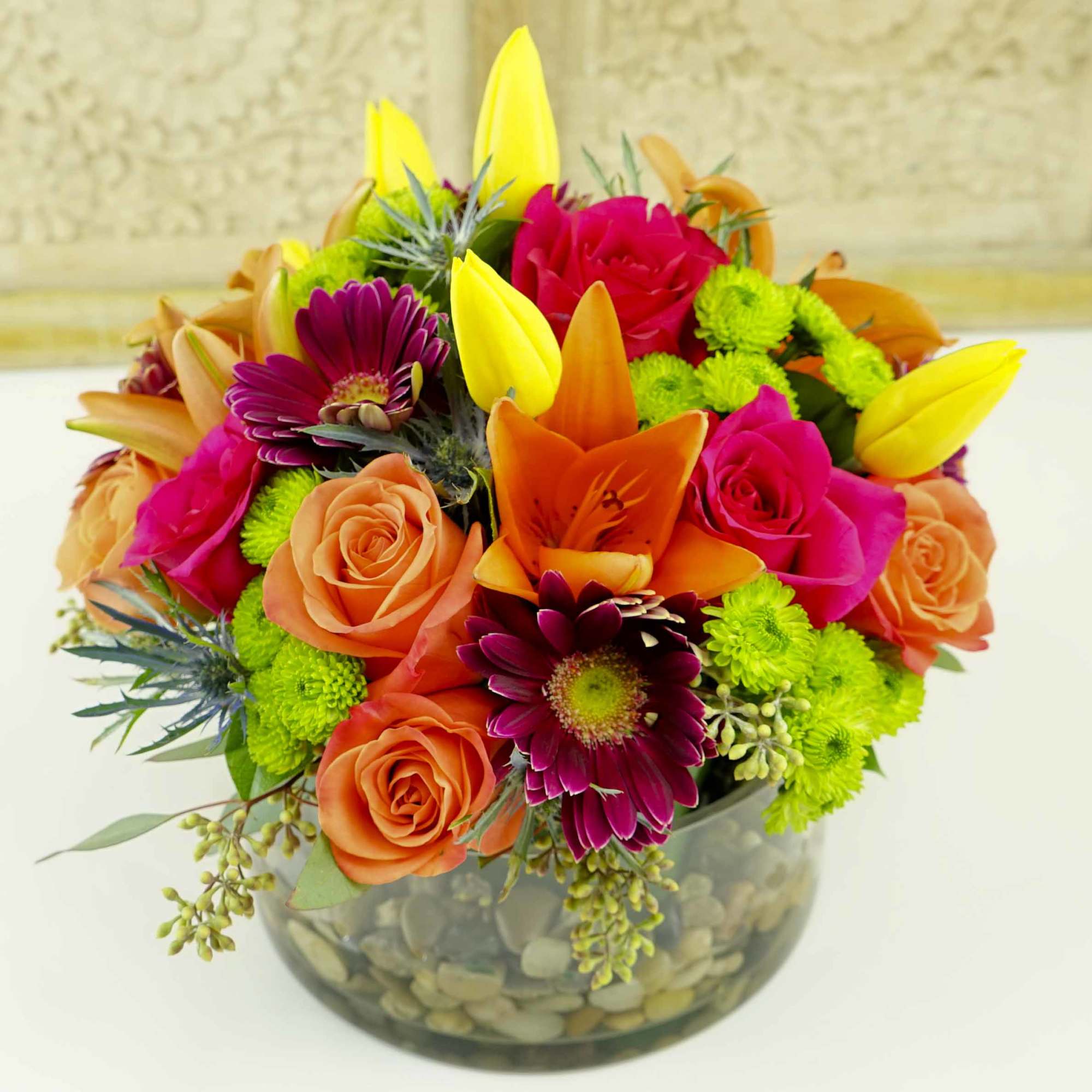 A colorful mixture of seasonal flowers such as Tulips, Asiatic Lilies &amp;