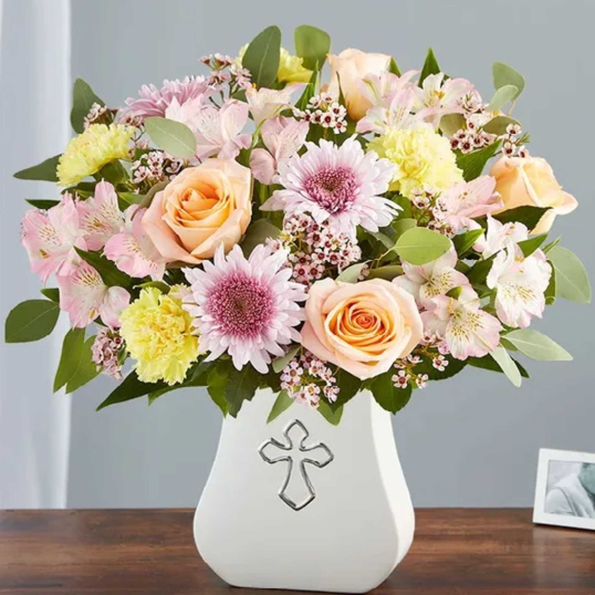Gathered with peach, lavender, pink and yellow blooms, it’s elegantly arranged  Gathered with peach, lavender, pink and yellow blooms, it’s elegantly arranged