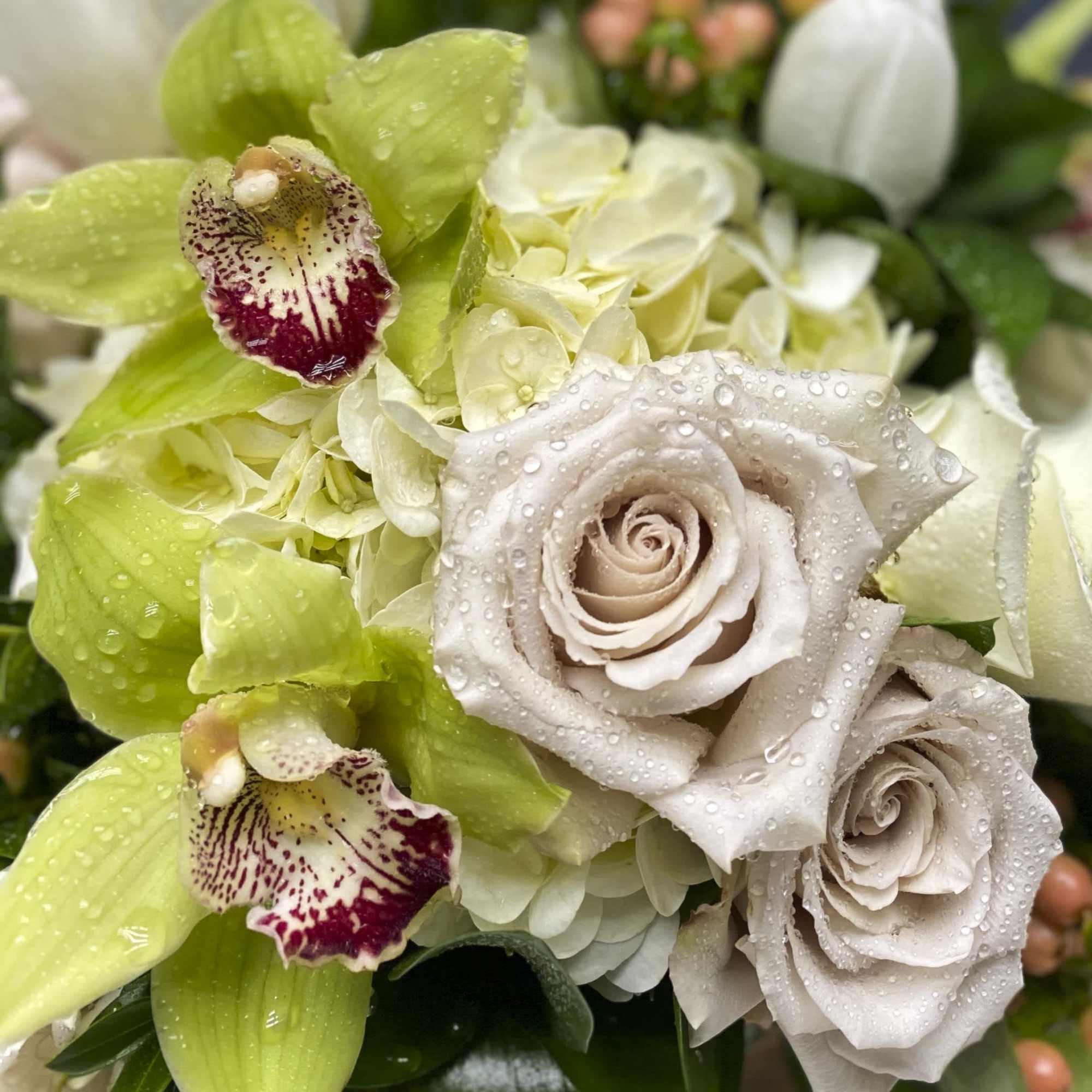 Beautiful arrangement comes with manzanita & hanging succulents with lovely roses and Beautiful arrangement comes with manzanita & hanging succulents with lovely roses and