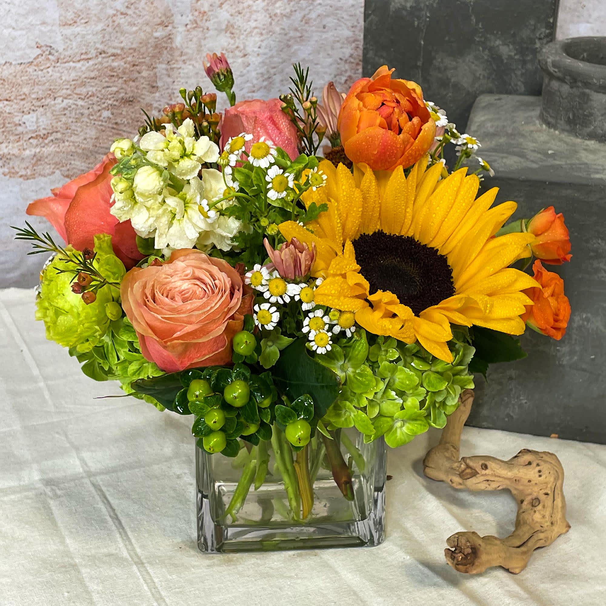Let Sparks fly with this arrangement.&nbsp;Sparks features sunflowers, green hydrangea, tulips, chamomile
