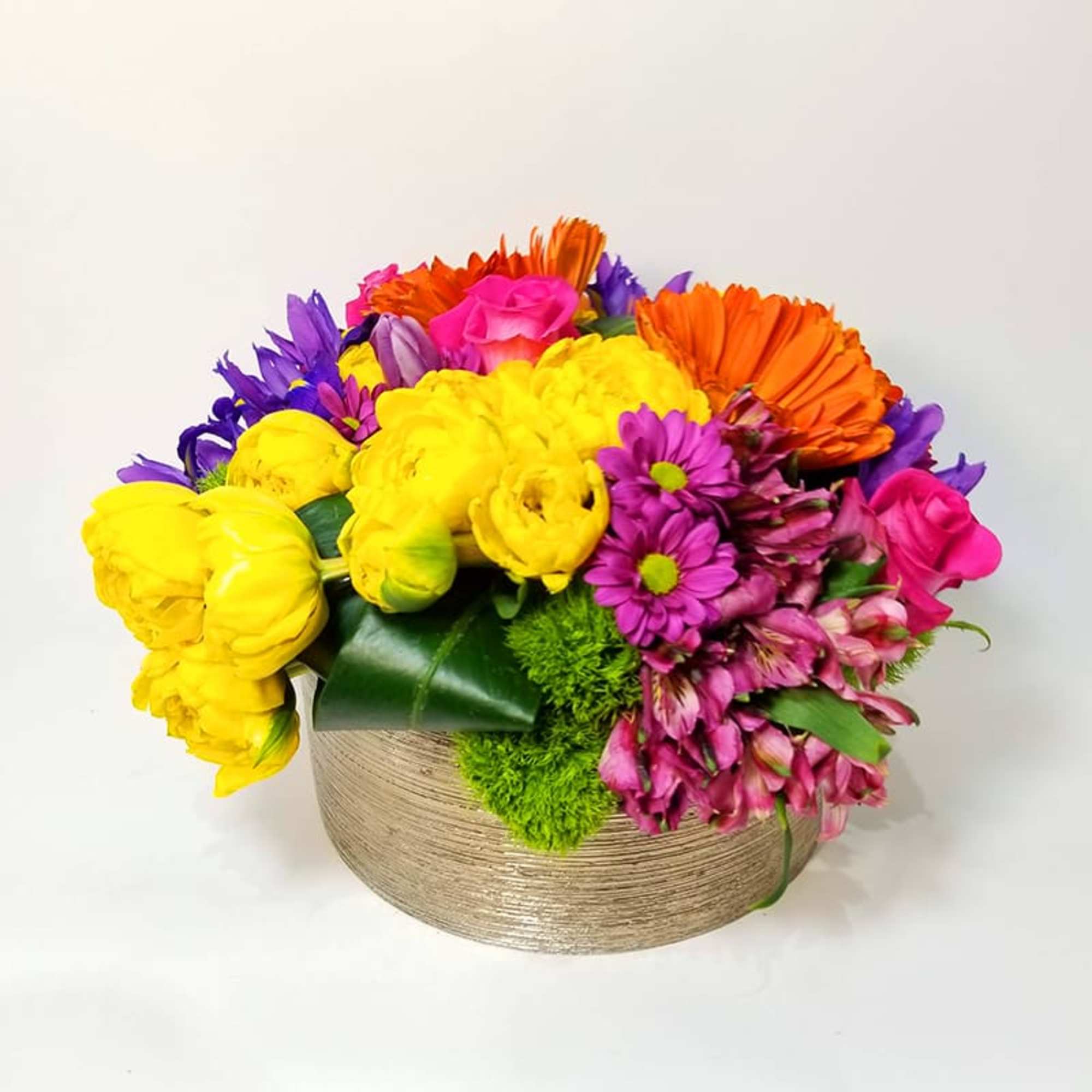 Spring Spirit for Her. Arrangement of colorful Gerber&#039;s, roses, bottoms, and other