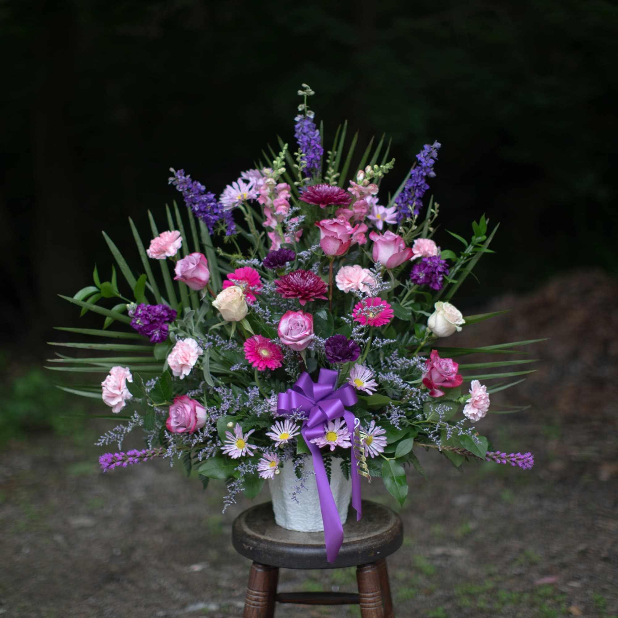 Wildflower inspired floral tribute basket in lovely lavender, indigo and purple tones Wildflower inspired floral tribute basket in lovely lavender, indigo and purple tones