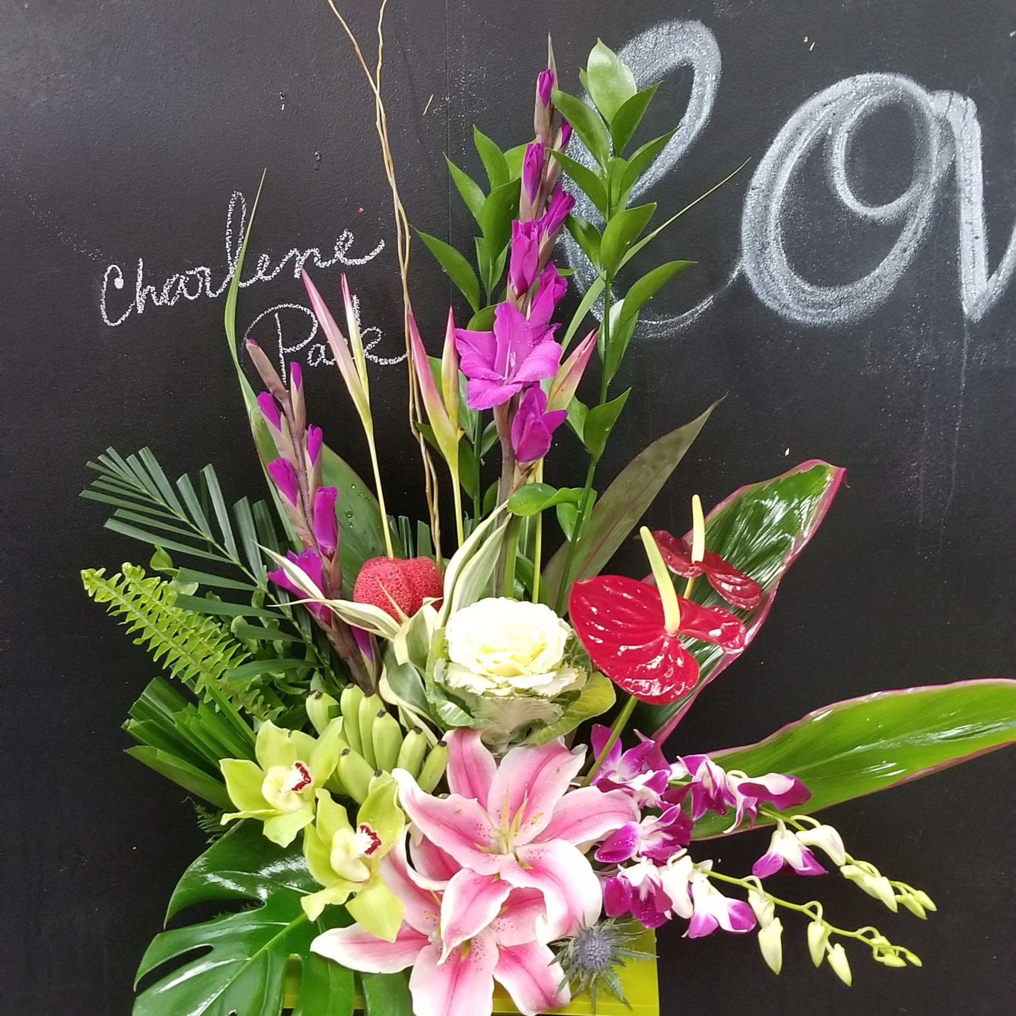 This Hawaiian hugs and kisses Arrangement including tropical flowers like ginger, protea