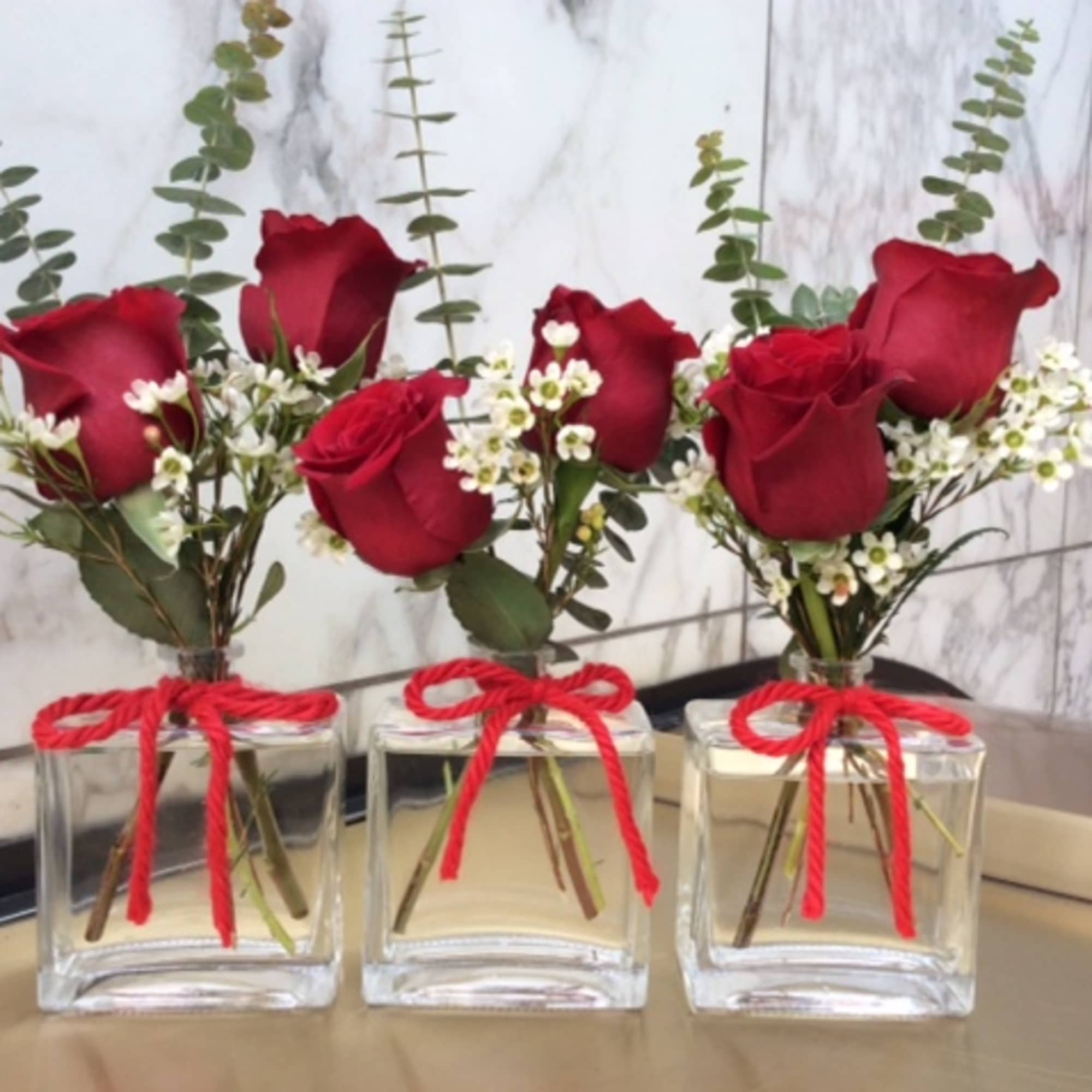 .set of 3  glass perfume bottes fill with red roses
