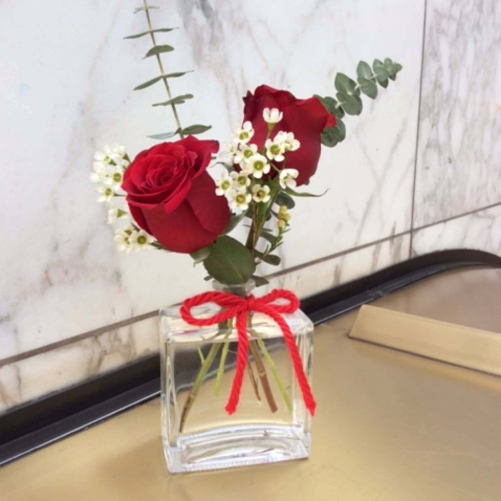 .set of 3  glass perfume bottes fill with red roses