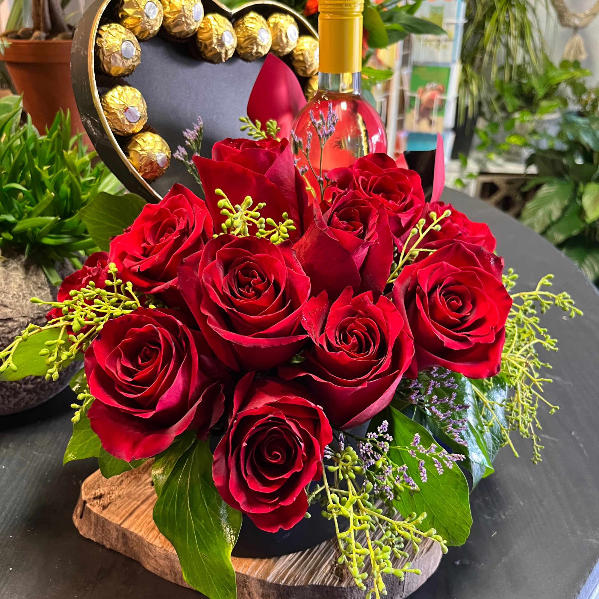 One dozen carefully selected roses, chocolates and a bottle of your choice