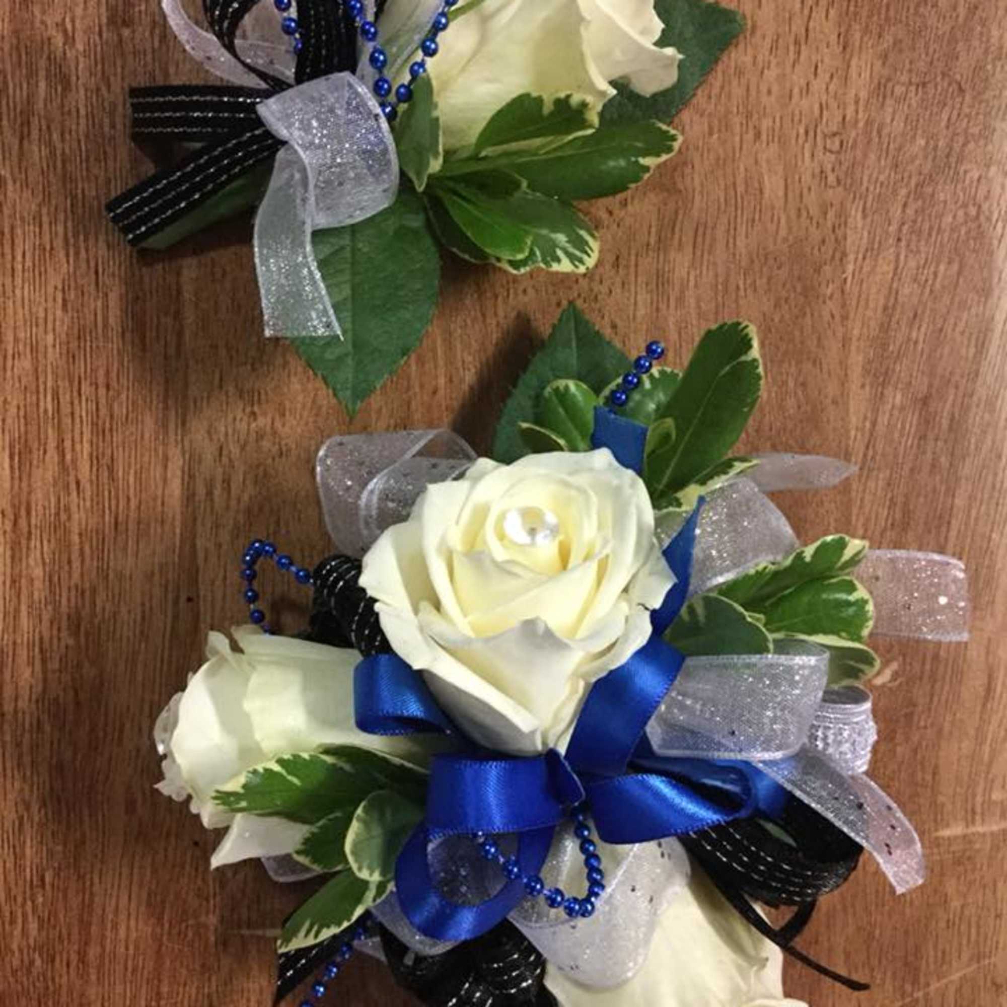 Prom/Wedding flowers perfected!! EIther single, or as a pair. Boutonnieres begin at